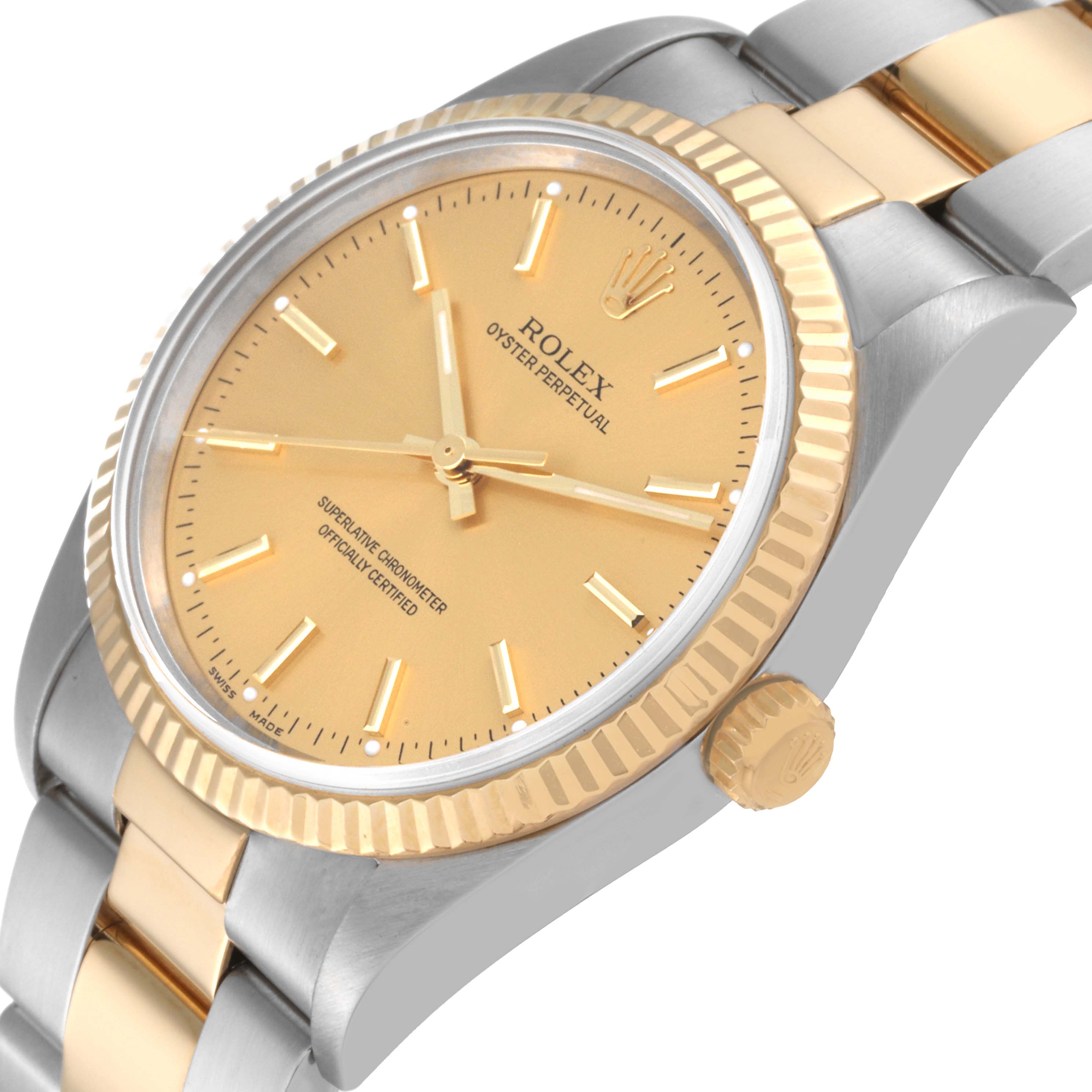 This image shows a close-up, angled view of the dial, bezel, and bracelet of the Rolex Oyster Perpetual 14233 Men's Steel and Gold (two tone) Champagne Dial 14233 Men's Steel and Gold (two tone) Champagne Dial watch.