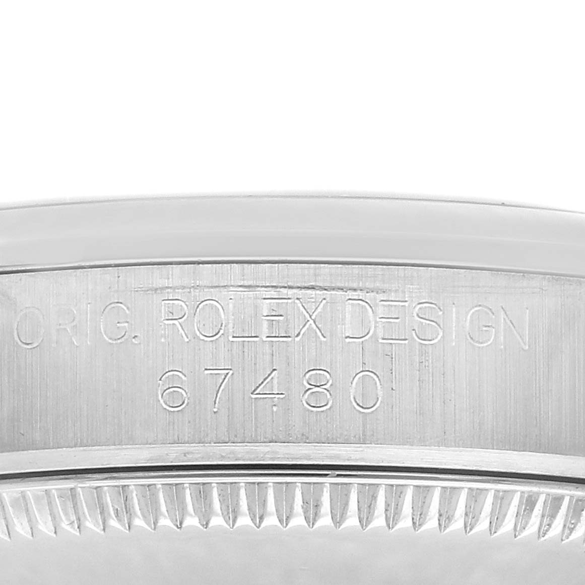 The image shows a close-up of the side of the Rolex Oyster Perpetual watch, model number 67480, focusing on the engraved "Orig. Rolex Design" and model number.