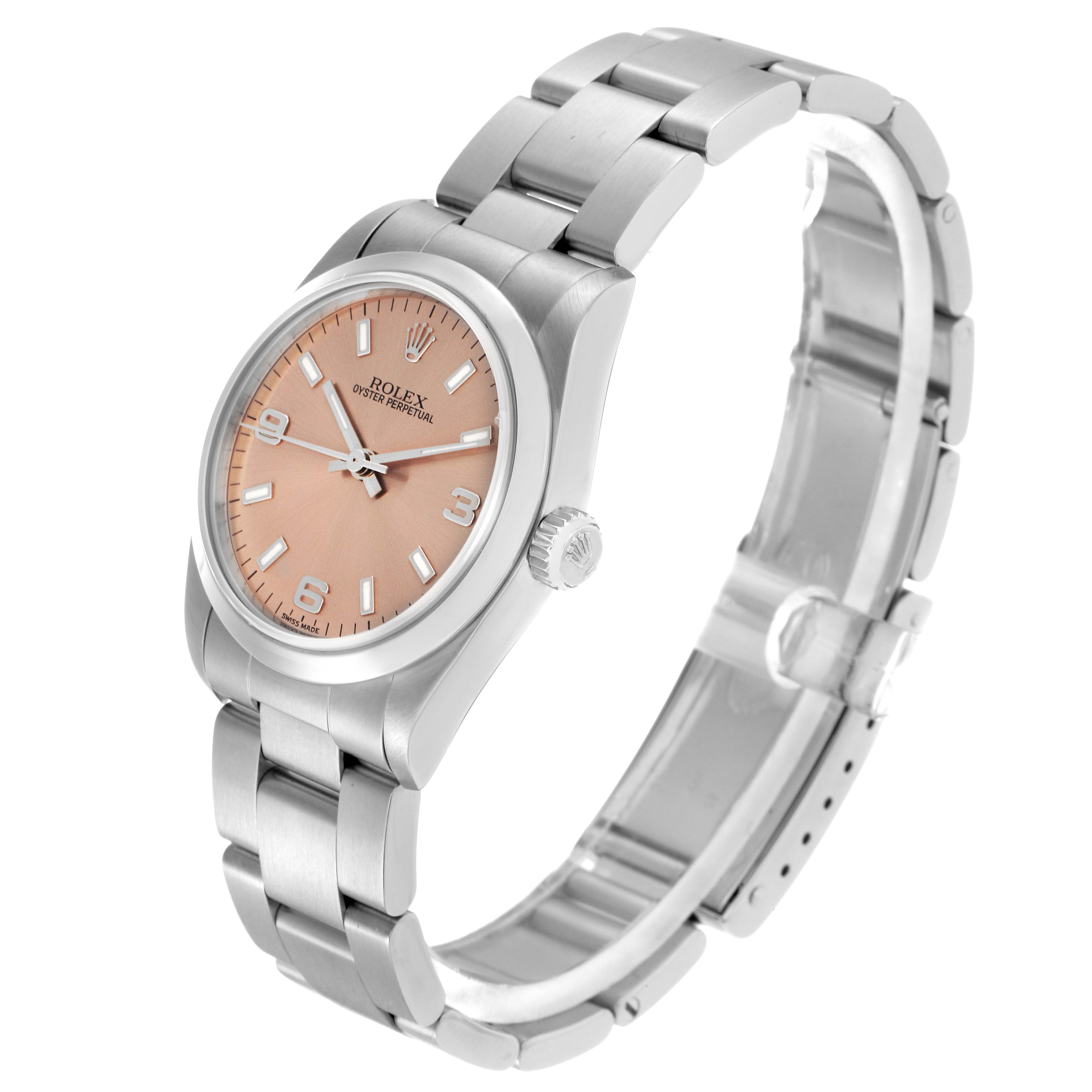 The Rolex Oyster Perpetual model 67480 is shown at a side angle, highlighting its face, bezel, crown, and bracelet.