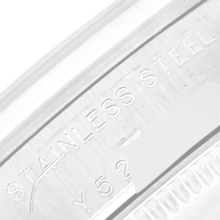 The image shows an angled close-up of the case back of a stainless steel Rolex Mid-Size 77080 Women's Stainless Steel Pink Dial 77080 Women's Stainless Steel Pink Dial watch, highlighting its engravings and serial number.