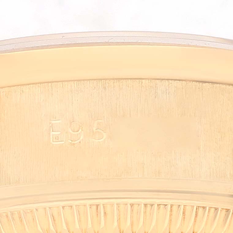 This image shows a close-up of the engraved inner side of the bezel from a Rolex President 69138 Women
s Yellow Gold Champagne Dial 69138 Women
s Yellow Gold Champagne Dial watch.