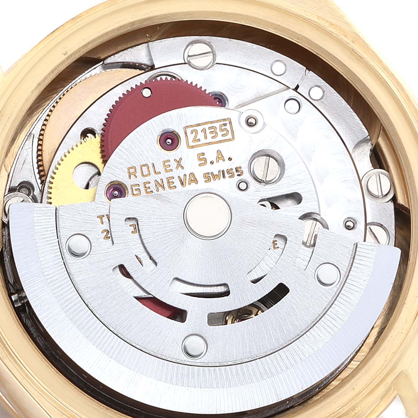 This image shows the intricate internal mechanism of a Rolex President 69138 Women
s Yellow Gold Champagne Dial 69138 Women
s Yellow Gold Champagne Dial model watch from a top-down angle.