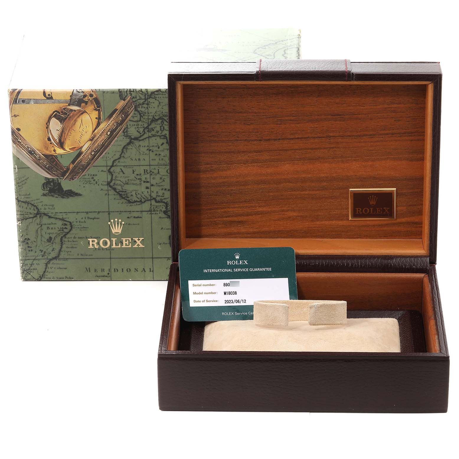 The image shows the Rolex President 18038 Men
s Yellow Gold Champagne Dial 18038 Men
s Yellow Gold Champagne Dial model box and accessories, including international service guarantee cards.