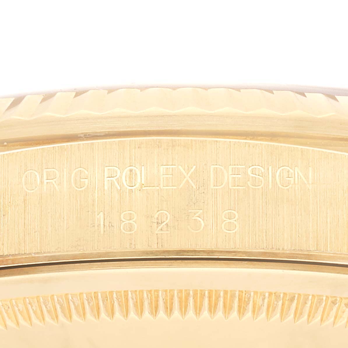 This image shows a close-up of the case side of a Rolex President 18238 Men's Yellow Gold Champagne Dial 18238 Men's Yellow Gold Champagne Dial model, displaying "ORIG ROLEX DESIGN" and the model number 18238.