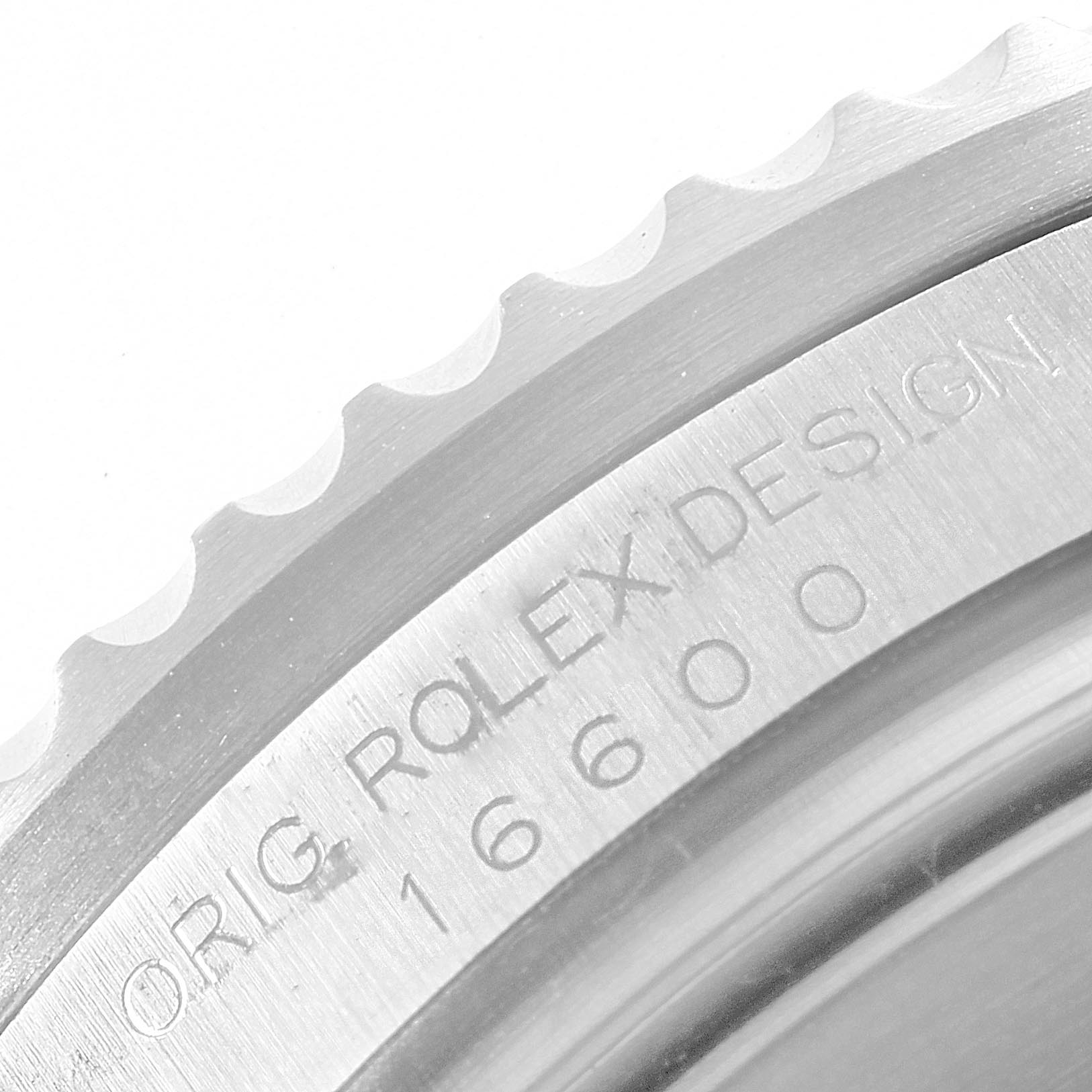 The image shows a close-up of the Rolex Sea-Dweller model 16600 bezel with visible engravings.