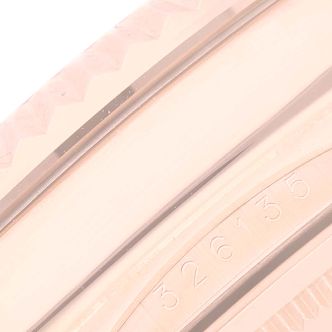 The image shows a close-up of the side and bezel details of the Rolex Sky-Dweller 326135 Men's Rose Gold Brown Dial 326135 Men's Rose Gold Brown Dial watch, highlighting the fluted bezel and part of the reference number.