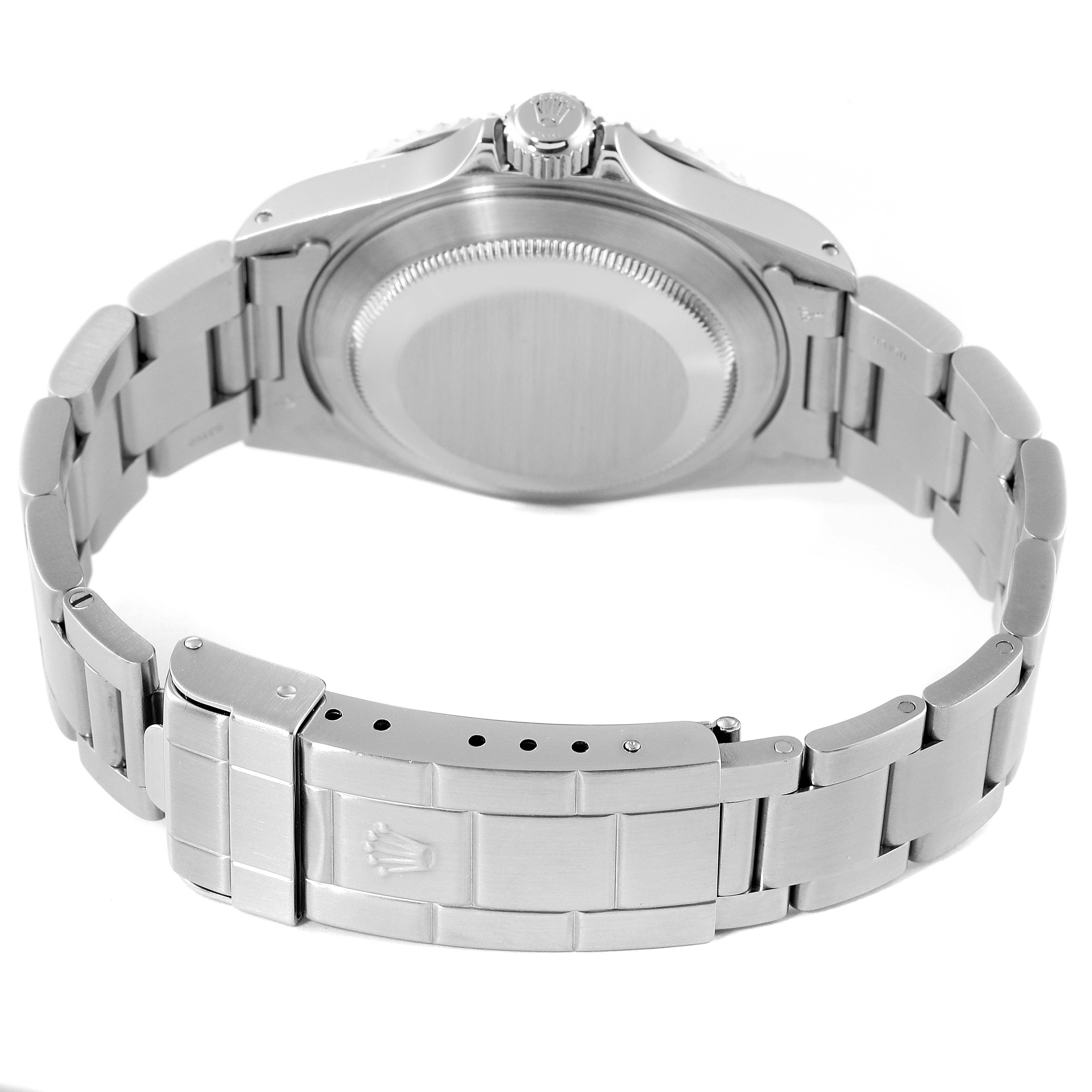 The image shows the back angle of a Rolex Submariner 14060 Men
s Stainless Steel Black Dial 14060 Men
s Stainless Steel Black Dial watch, focusing on the case back and metal bracelet clasp.