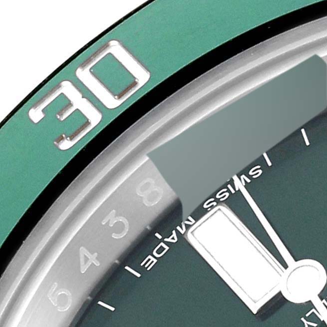 This close-up image shows the bezel, part of the dial, and the "SWISS MADE" text of the Rolex Submariner 116610LV Men
s Stainless Steel Green Dial 116610LV Men
s Stainless Steel Green Dial watch.