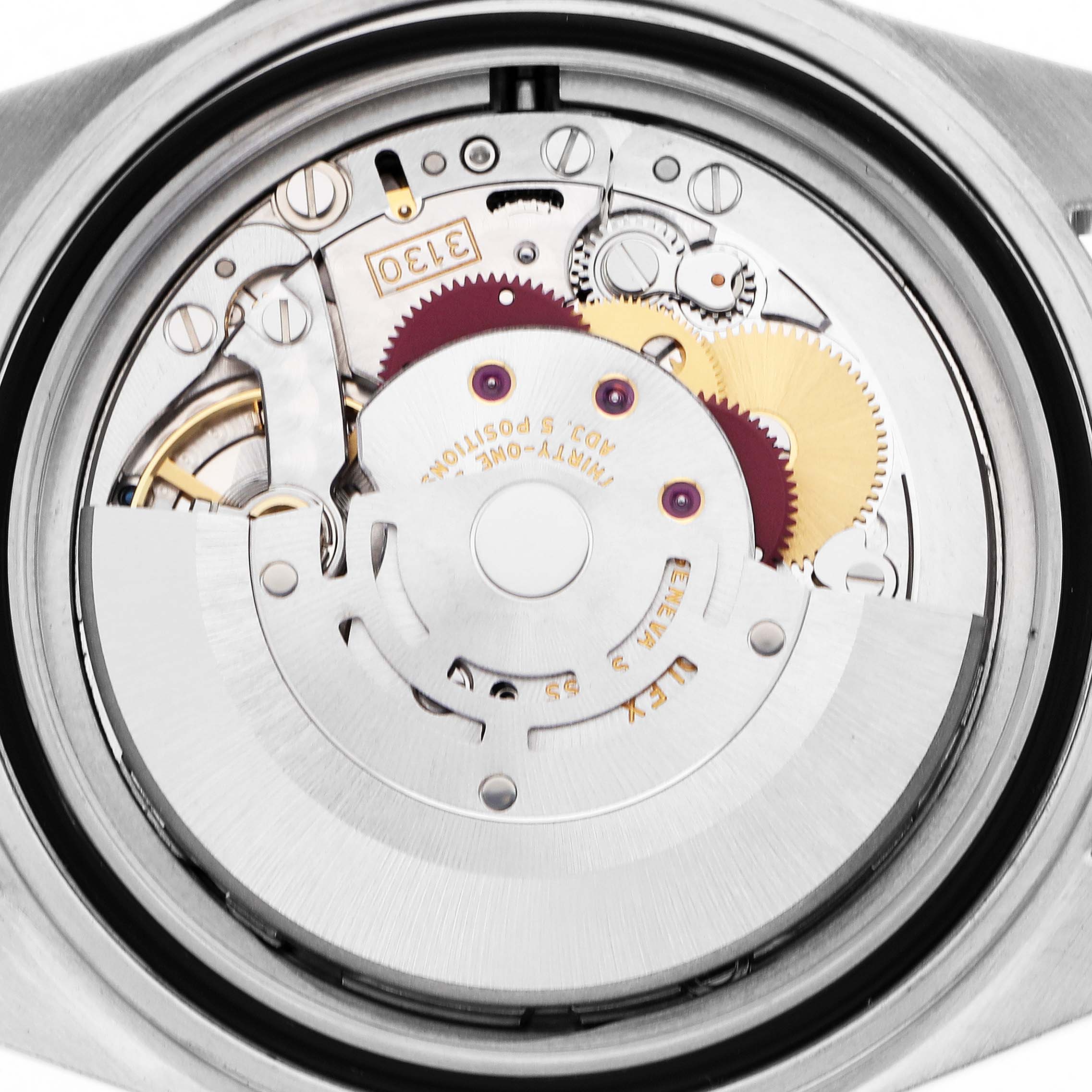 The image shows the internal movement of a Rolex Submariner model 14060, viewed from the back, highlighting gears and mechanical components.