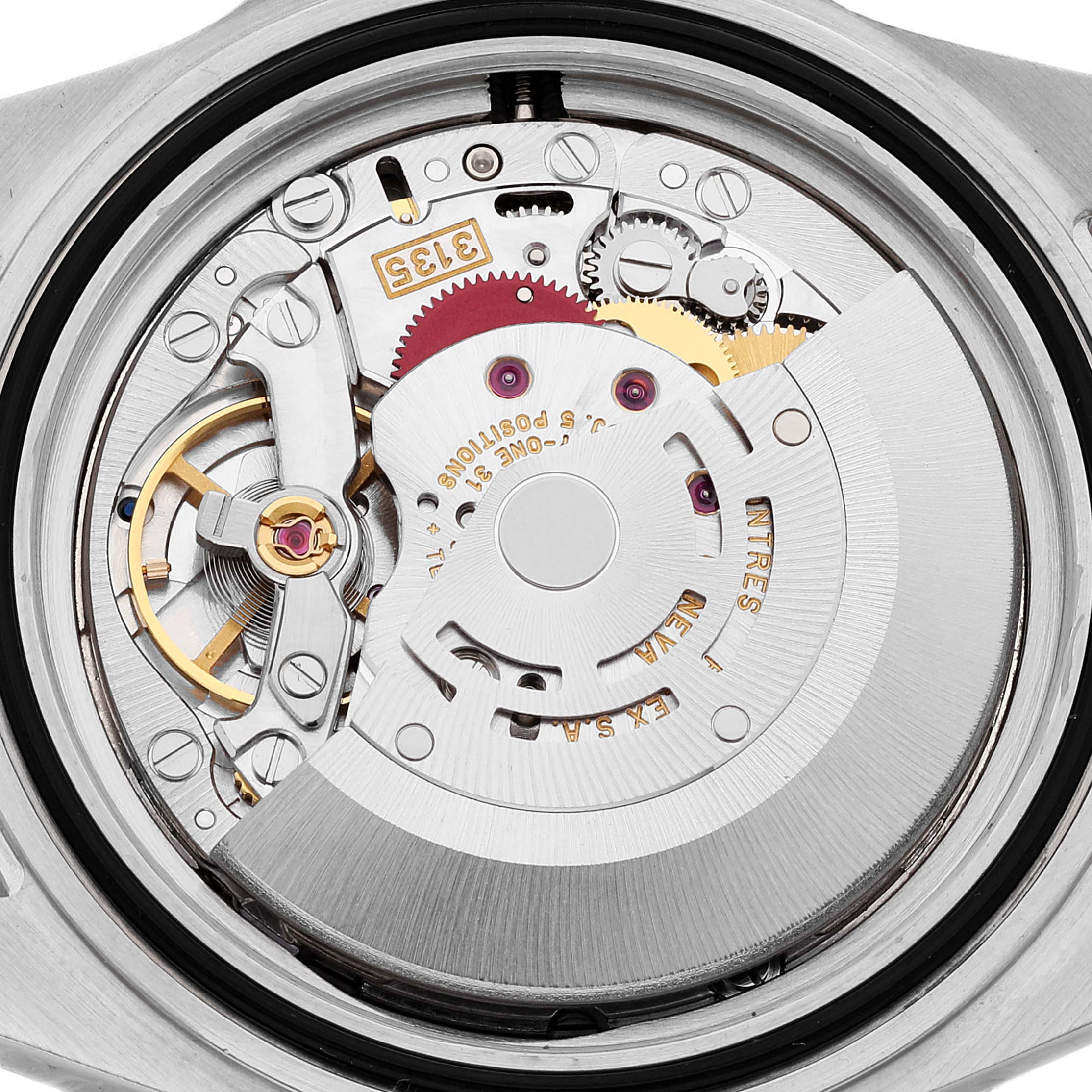 The image shows the back side and internal mechanism of a Rolex Submariner 16613 Men's Steel and Gold (two tone) Grey Dial 16613 Men's Steel and Gold (two tone) Grey Dial watch, revealing its intricate movement components.