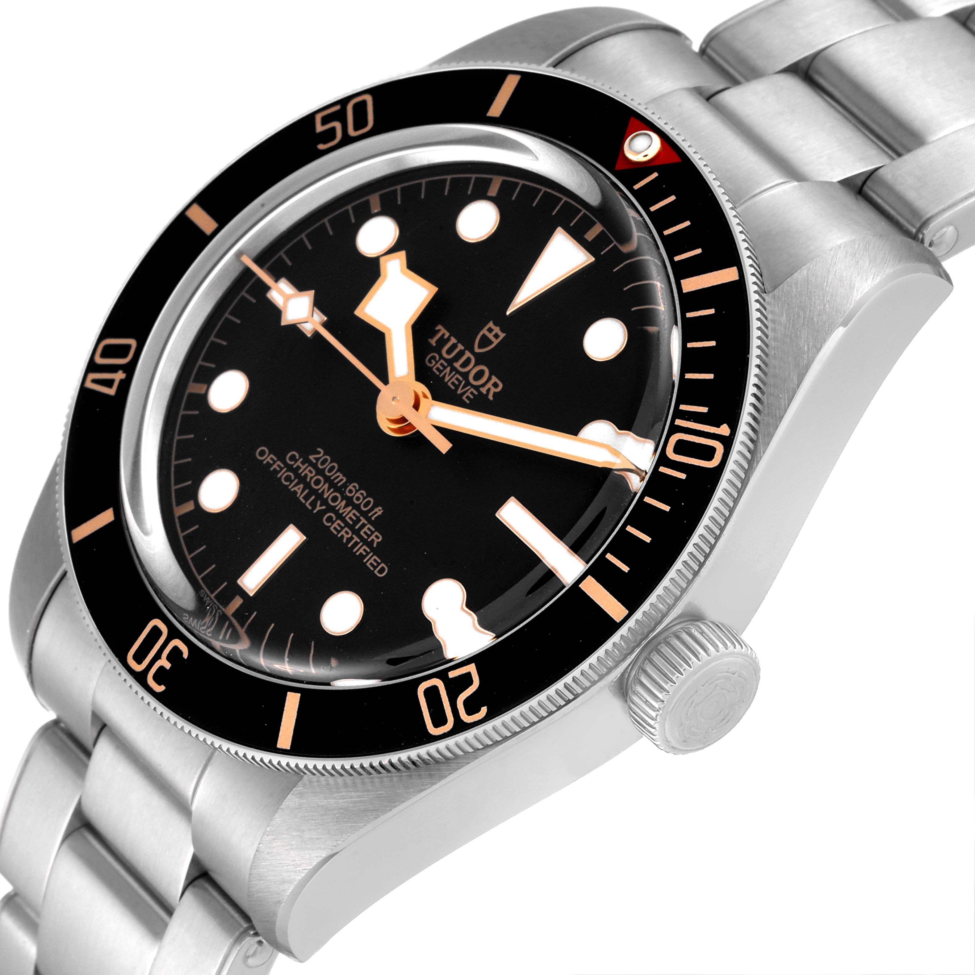 The image shows a close-up side view of the Tudor Heritage Black Bay 79030N Men
s Stainless Steel Black Dial 79030N Men
s Stainless Steel Black Dial watch, highlighting the dial, bezel, and part of the bracelet.