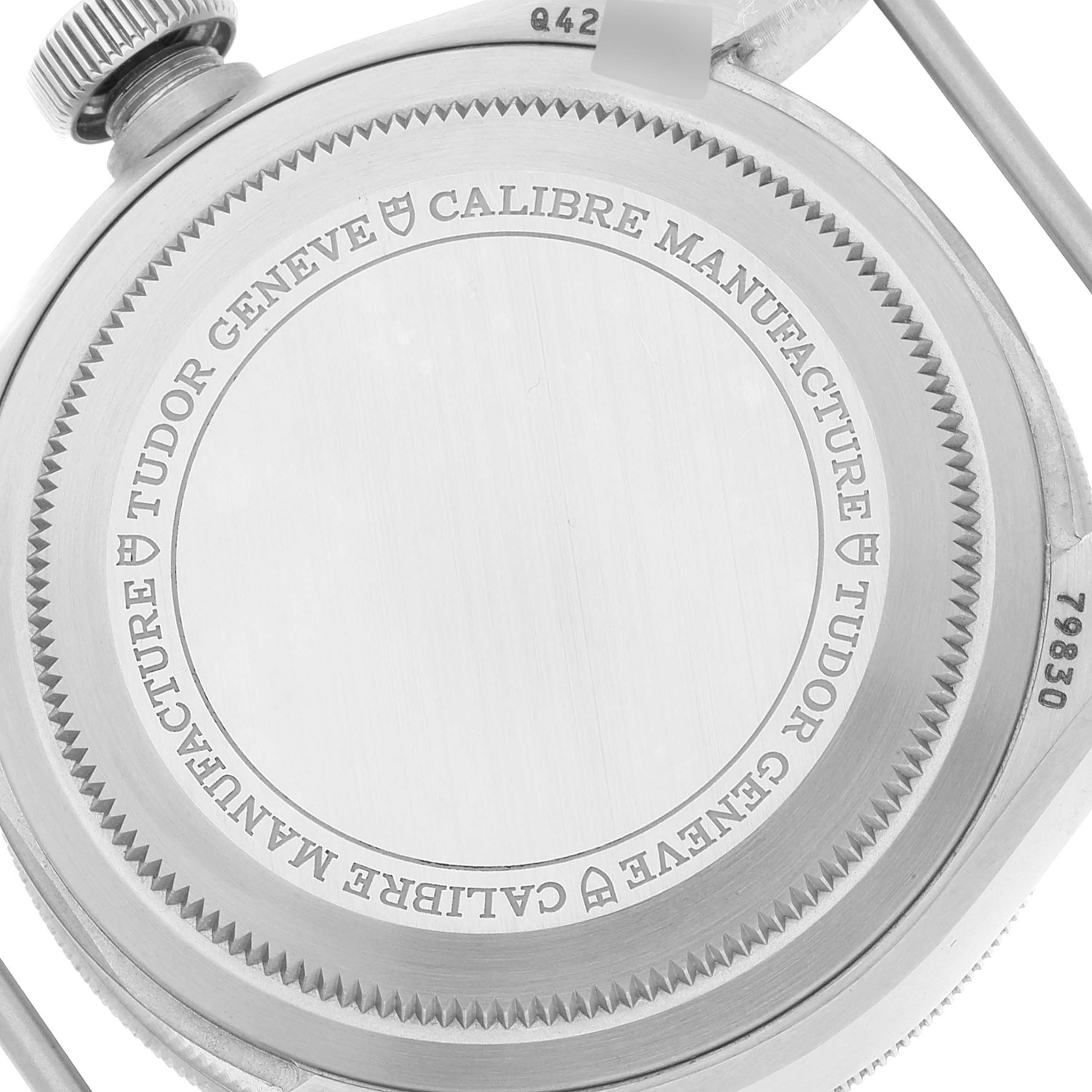 This image shows the back case of the Tudor Heritage Black Bay 79830RB Men's Stainless Steel Black Dial 79830RB Men's Stainless Steel Black Dial watch, highlighting engraved details and the crown.