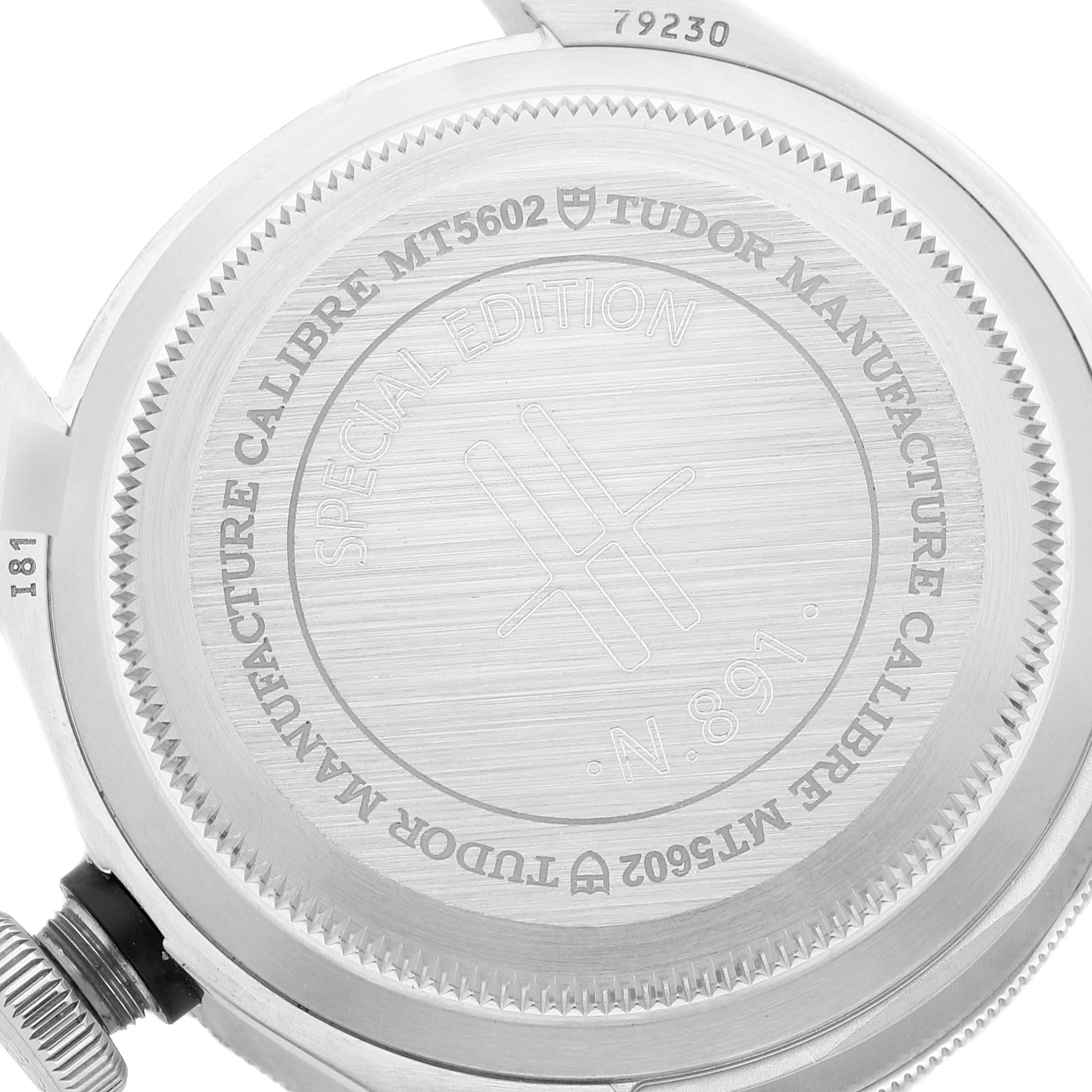 This image shows the back case of the Tudor Heritage Black Bay 79230G Men's Stainless Steel Black Dial 79230G Men's Stainless Steel Black Dial watch, revealing the engraved details and model information.