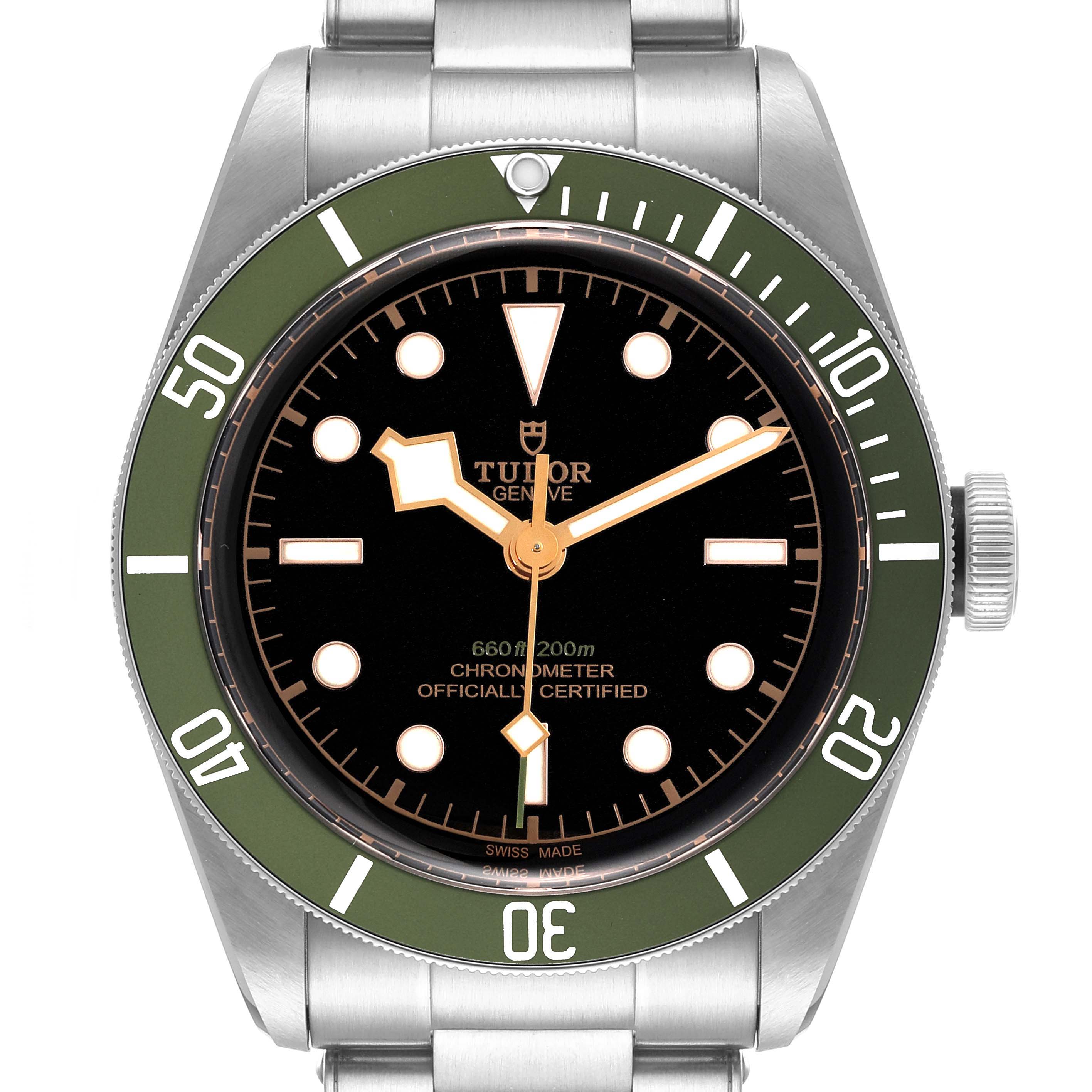 The image shows a front view of the Tudor Heritage Black Bay 79230G Men's Stainless Steel Black Dial 79230G Men's Stainless Steel Black Dial watch with a green bezel and black dial.