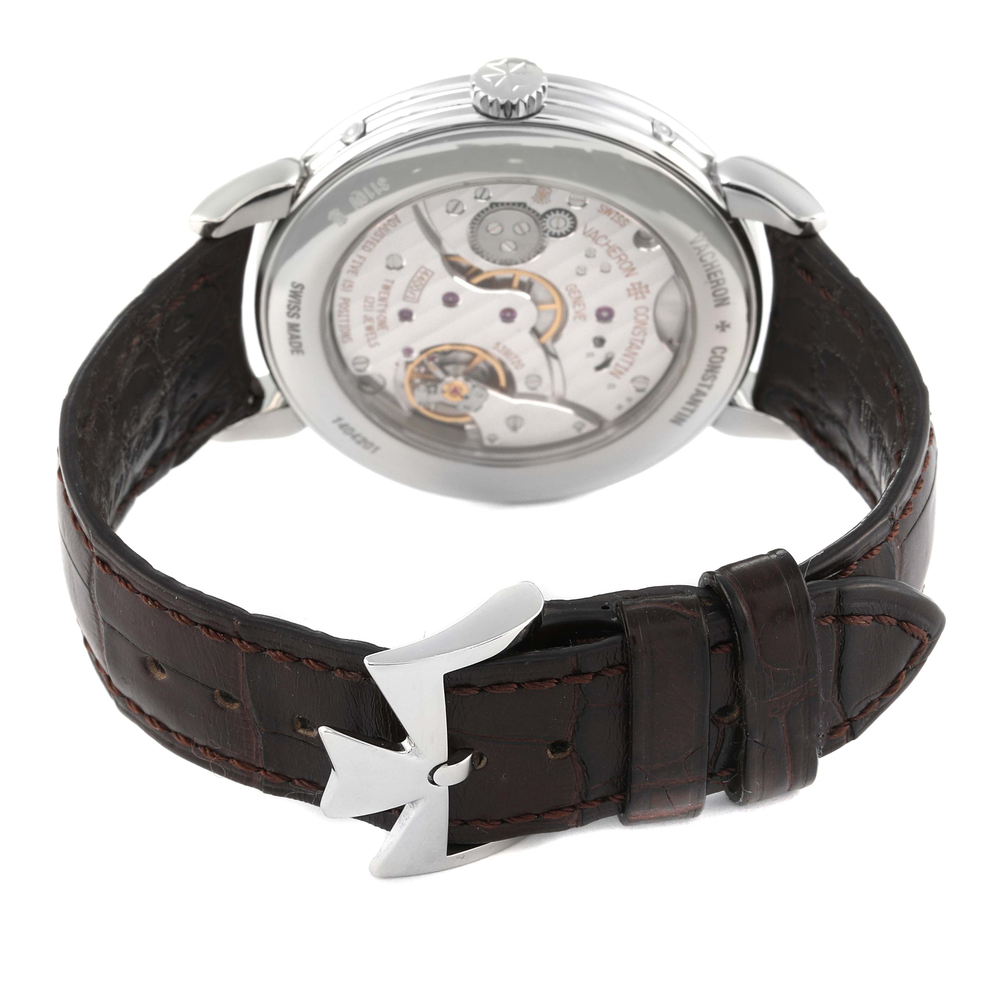The image shows the back view of a Vacheron Constantin Historiques 3110V/000A-B426 Men
s Stainless Steel Silver Dial 3110V/000A-B426 Men
s Stainless Steel Silver Dial watch, highlighting the movement and the brown leather strap with a distinctive buckle.