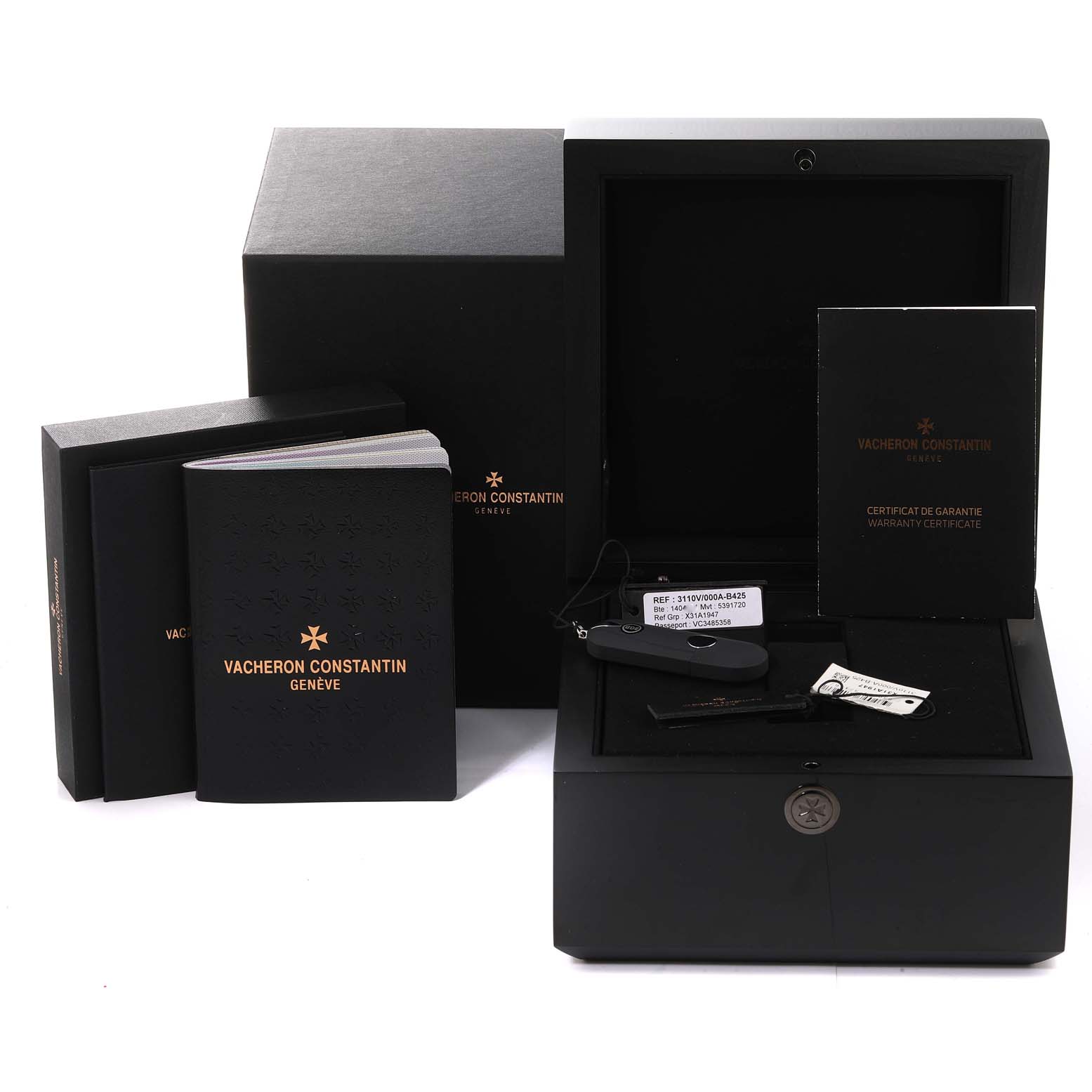 The image shows the packaging and accessories of the Vacheron Constantin Historiques 3110V/000A-B426 Men
s Stainless Steel Silver Dial 3110V/000A-B426 Men
s Stainless Steel Silver Dial model, including the box, manuals, and warranty certificate.