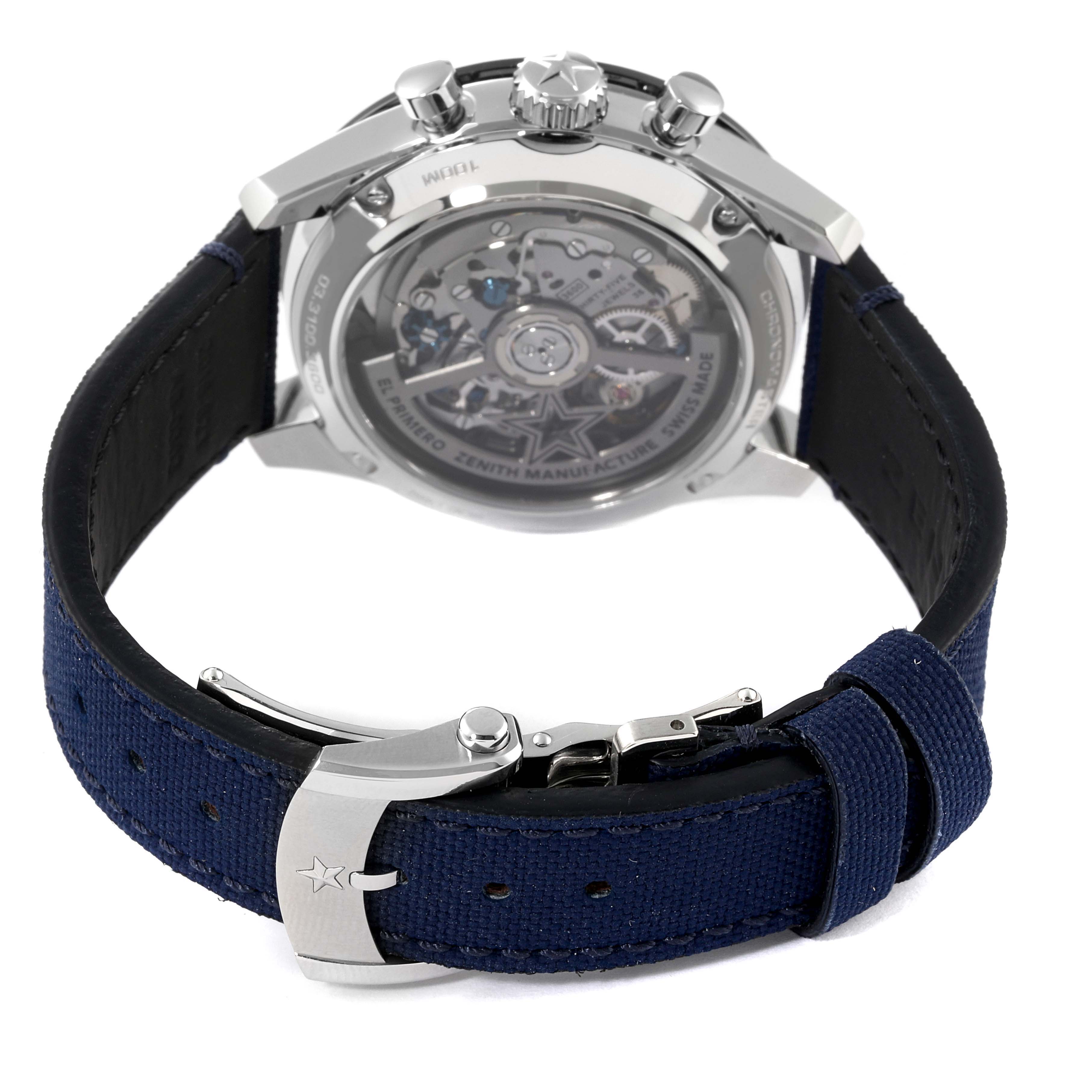 The image shows the back view of a Zenith Chronomaster 03.3100.3600/69.C823 Men's Stainless Steel White Dial 03.3100.3600/69.C823 Men's Stainless Steel White Dial watch displaying the movement and the buckle of the blue strap.