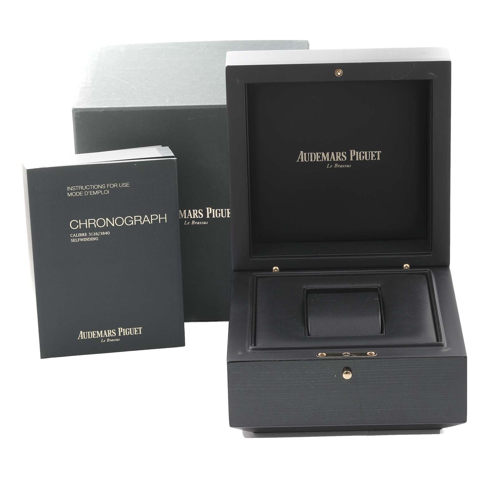 The image shows the box and user manual for the Royal Oak model by Audemars Piguet, both at a front angle.