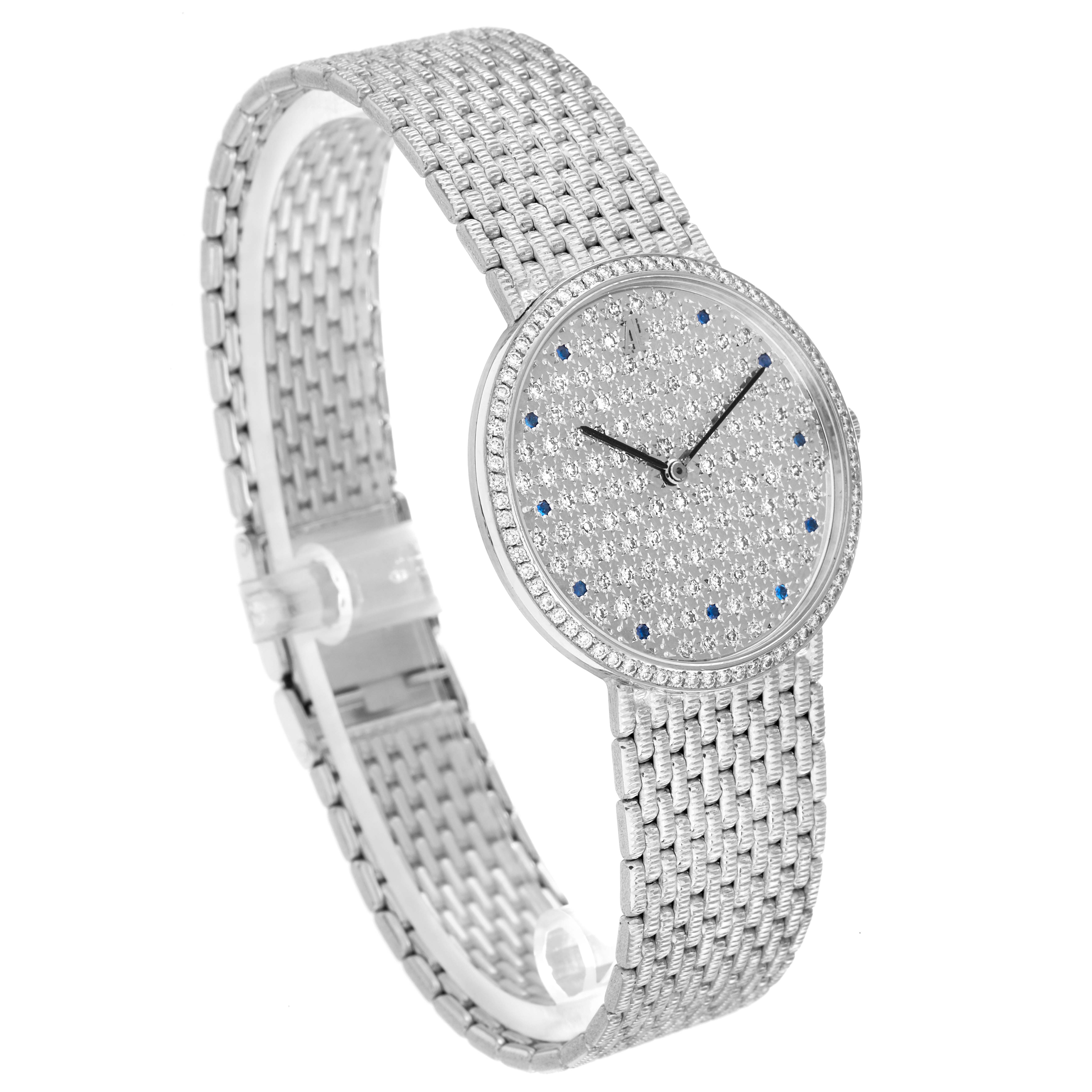 The Audemars Piguet Vintage Round White Gold Diamond Sapphire Ladies Watch is shown at a three-quarter angle, highlighting its diamond-set round face and woven bracelet.