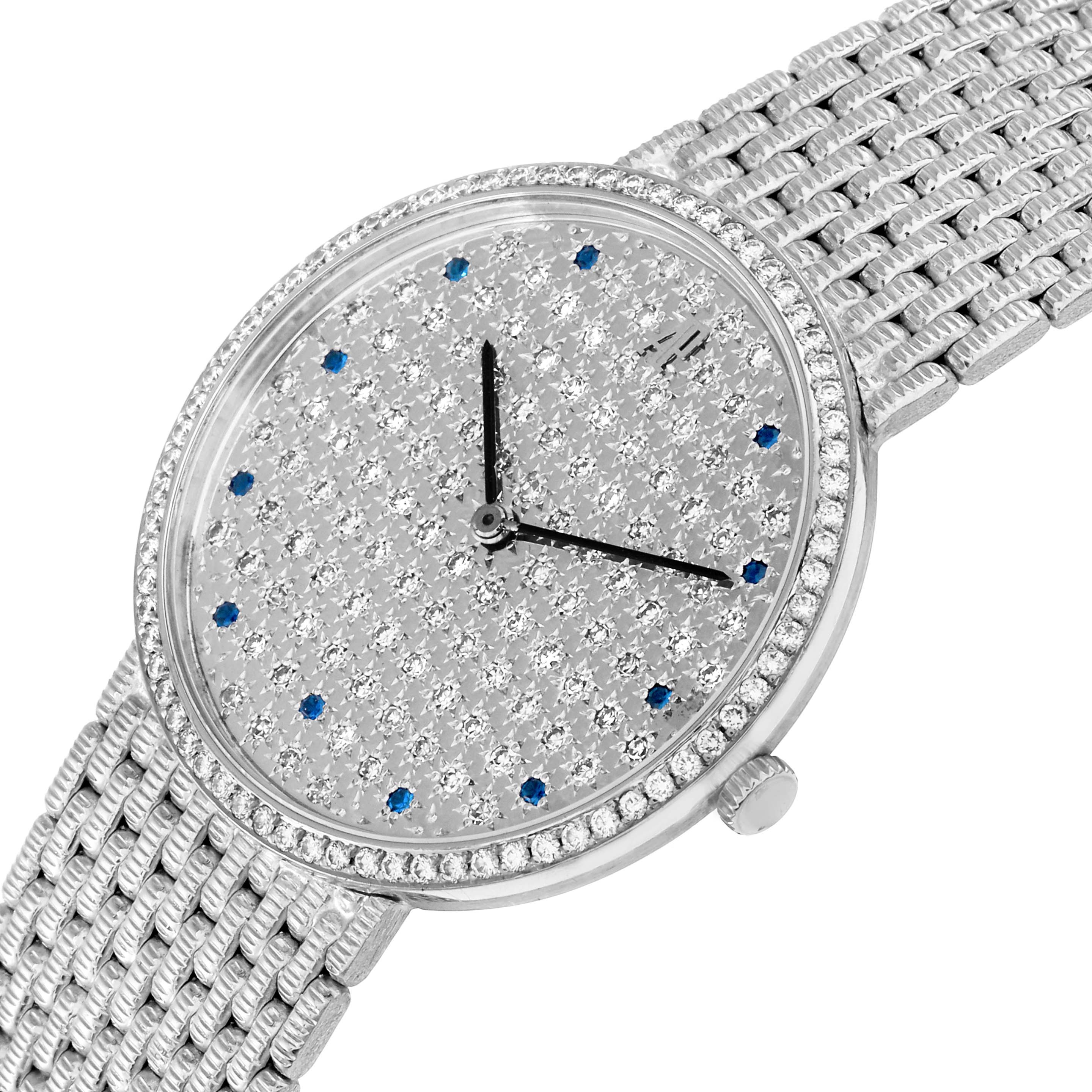 The Audemars Piguet Vintage Round White Gold Diamond Sapphire Ladies Watch is shown at an angled top view, highlighting the diamond-studded dial, sapphire markers, and textured bracelet.