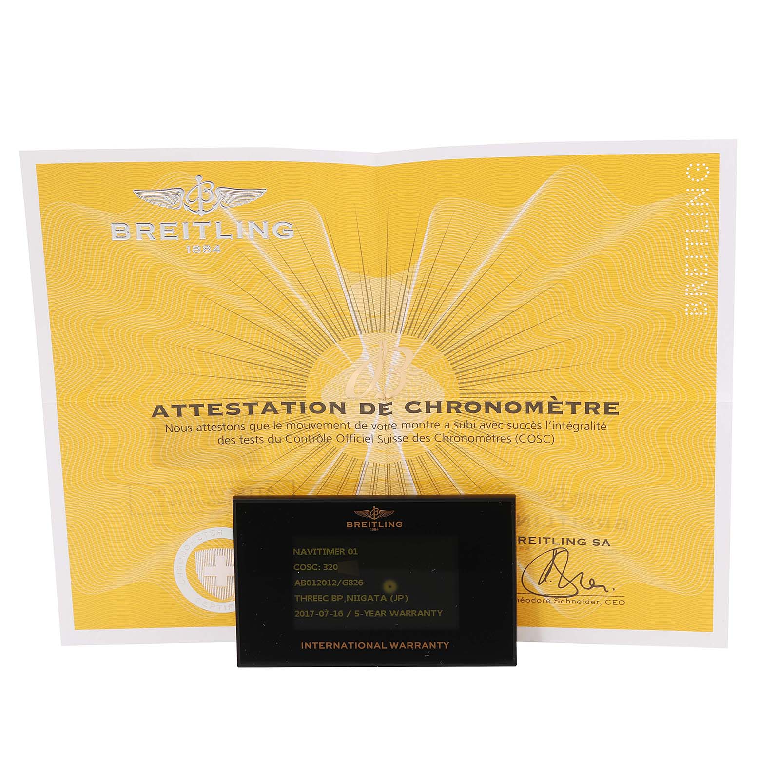 The image shows the Breitling Navitimer AB0120 Men
s Stainless Steel Silver Dial AB0120 Men
s Stainless Steel Silver Dial model
s warranty card and chronometer certificate, displayed from a straight-on angle.