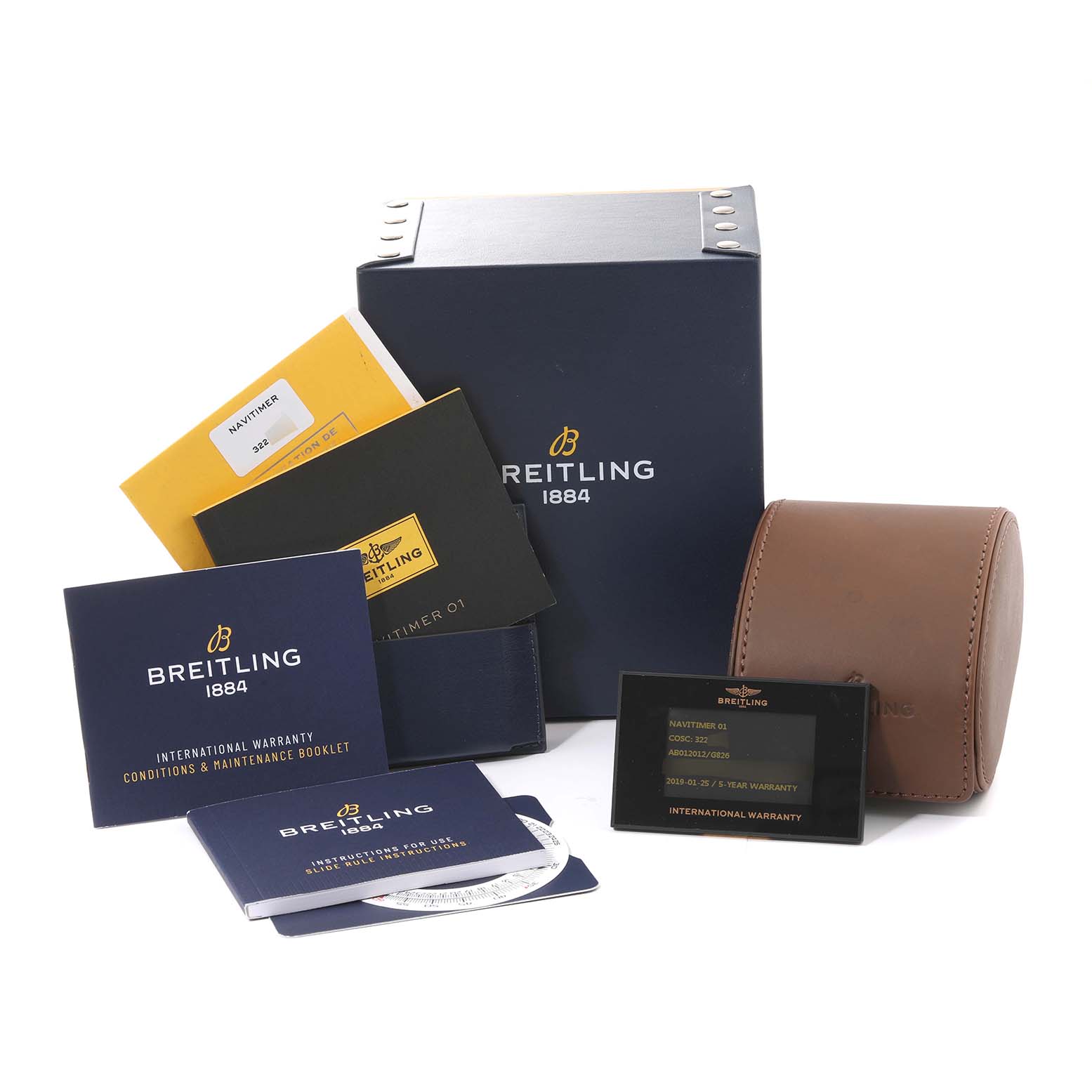 The image shows booklets, a warranty card, a watch box, and a leather case for the Breitling Navitimer AB0120 Men's Stainless Steel Silver Dial AB0120 Men's Stainless Steel Silver Dial model.
