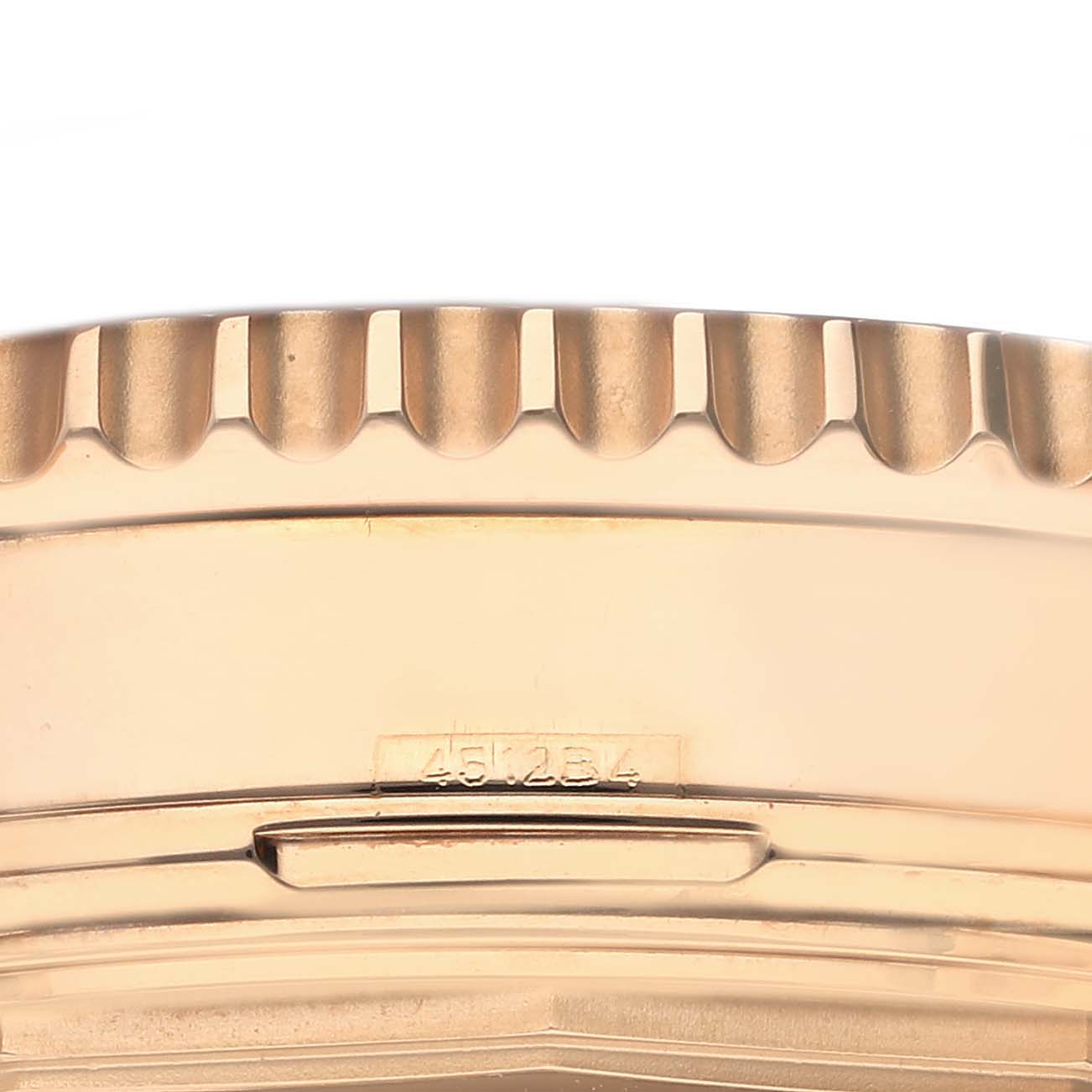 This image shows a close-up view of the side casing and bezel of a Breitling Navitimer RB0120 Men's Rose Gold Black Dial RB0120 Men's Rose Gold Black Dial watch.