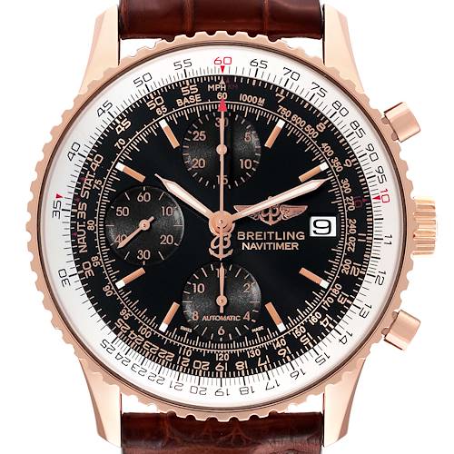 The image shows the front view of a Breitling Navitimer watch with a black dial, chronograph sub-dials, and a brown leather strap.