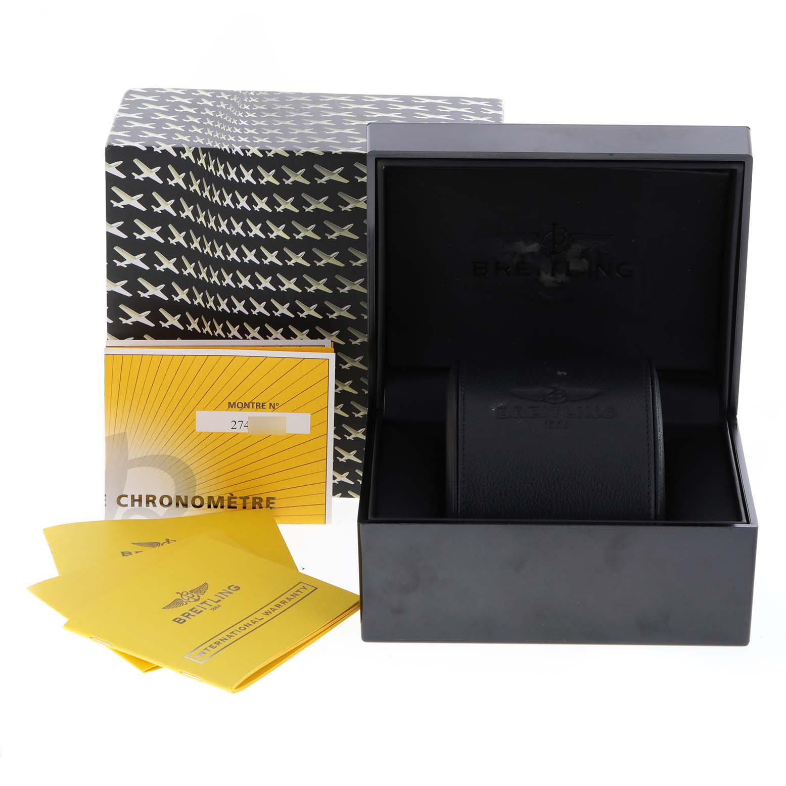 The image shows the packaging and accessories of a Breitling Chronomatic M14360 Men
s Stainless Steel Black Dial M14360 Men
s Stainless Steel Black Dial, including a box, warranty booklet, and documentation.