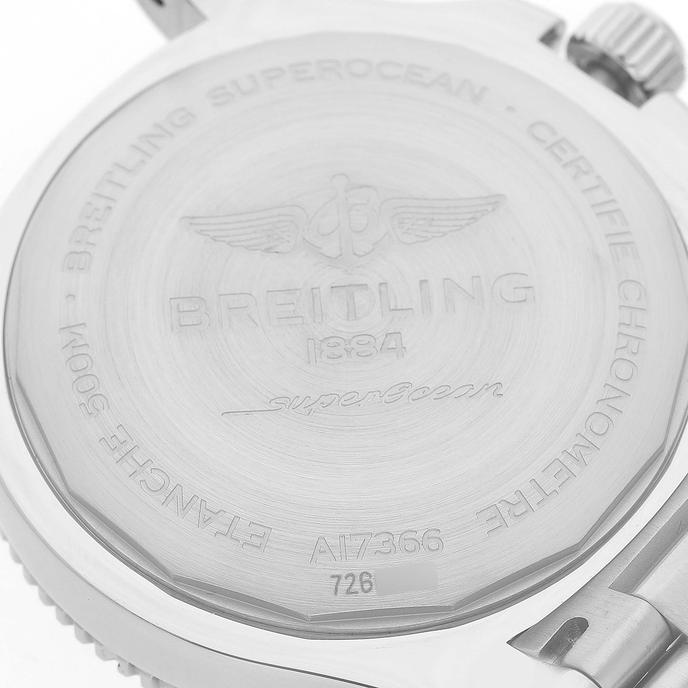 The Breitling Superocean A17366 Men's Stainless Steel Black Dial watch is shown from the back, displaying engravings and the crown.