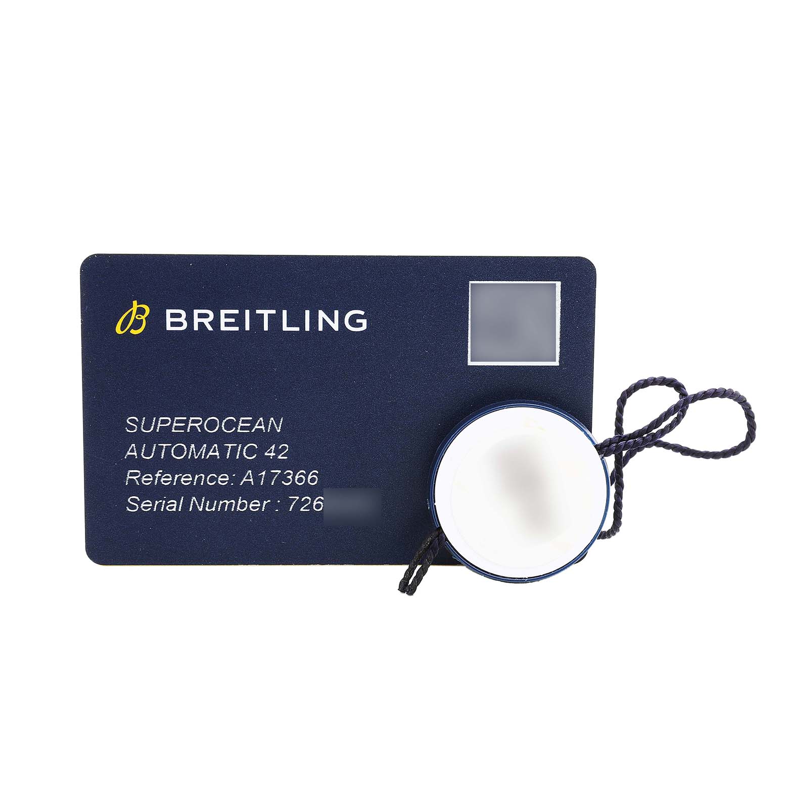 The image shows a Breitling Superocean A17366 Men's Stainless Steel Black Dial model card, including reference and serial numbers, with a round tag attached by a string.