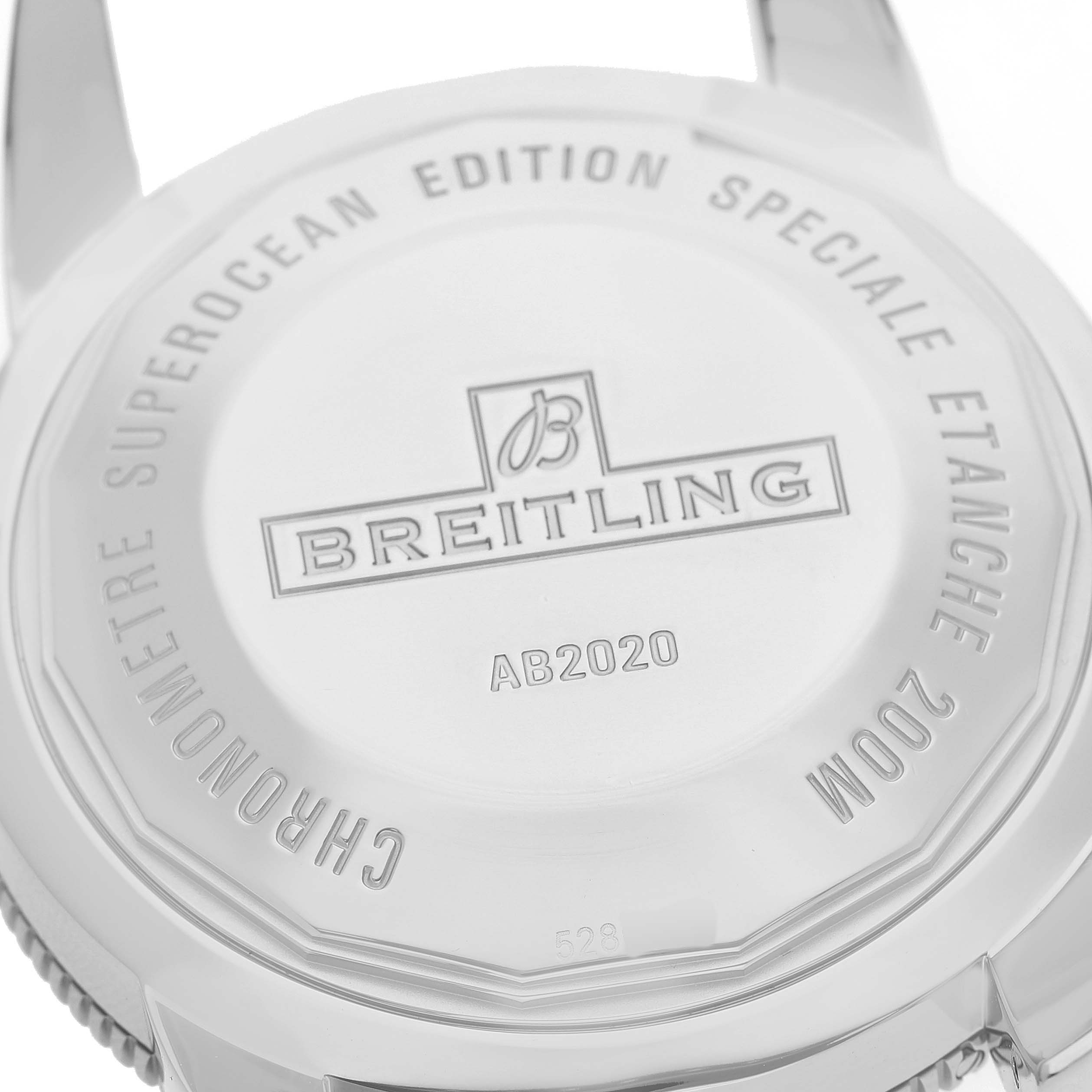 The image shows the case back of the Breitling Superocean AB2020121L1S1 Men's Stainless Steel Green Dial watch, highlighting the brand logo and model details.