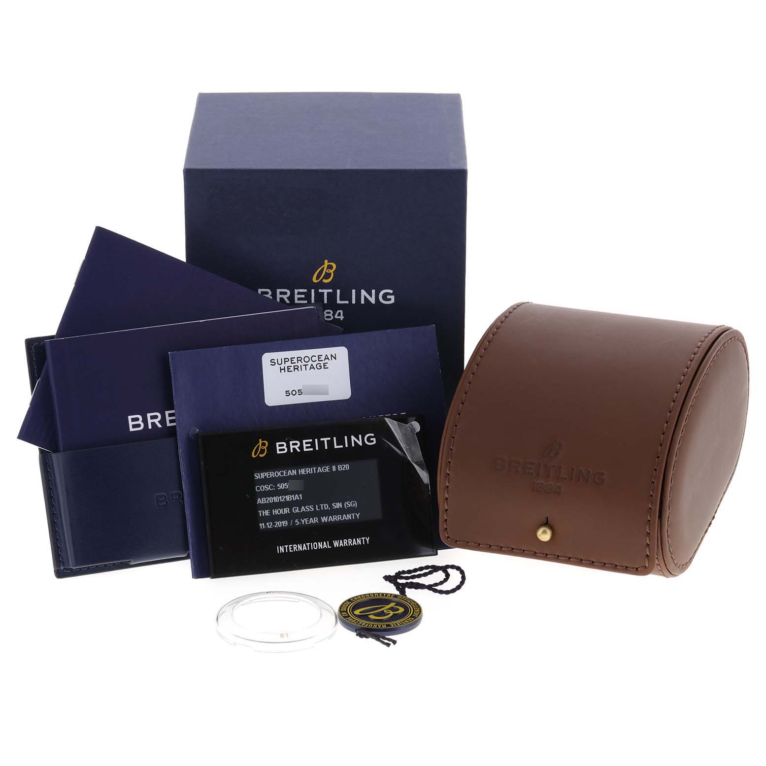 The image shows the Breitling Superocean AB2010161C1A1 Men
s Stainless Steel Black Dial AB2010161C1A1 Men
s Stainless Steel Black Dial watch accessories, including packaging, a case, warranty card, and tags.