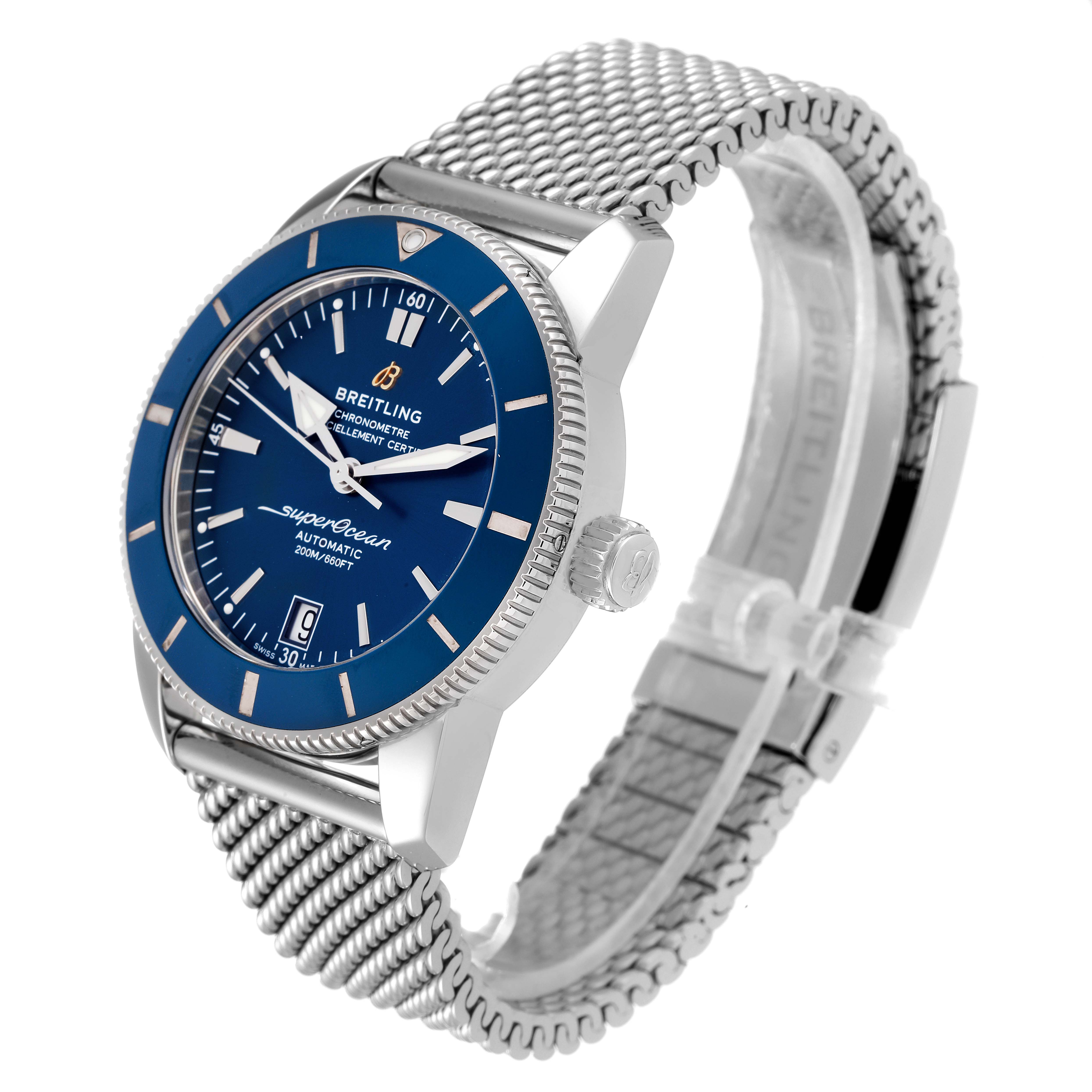 The image shows a side angle view of a Breitling Superocean AB2010 Men's Stainless Steel Blue Dial AB2010 Men's Stainless Steel Blue Dial watch, highlighting the blue dial, bezel, crown, and metal mesh strap.