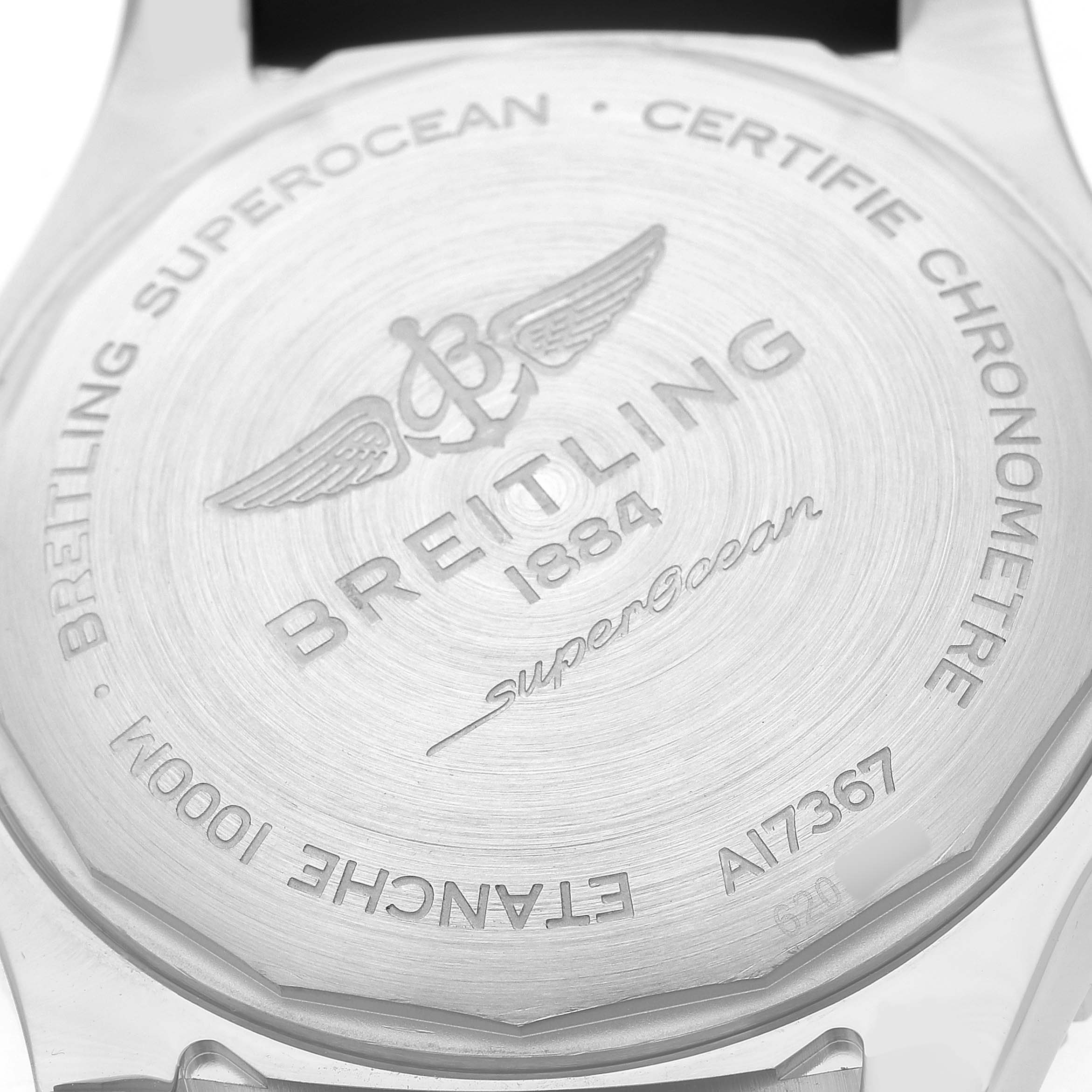 The image shows the back case of a Breitling Superocean A17367 Men's Stainless Steel Black Dial watch, highlighting its engraving details.