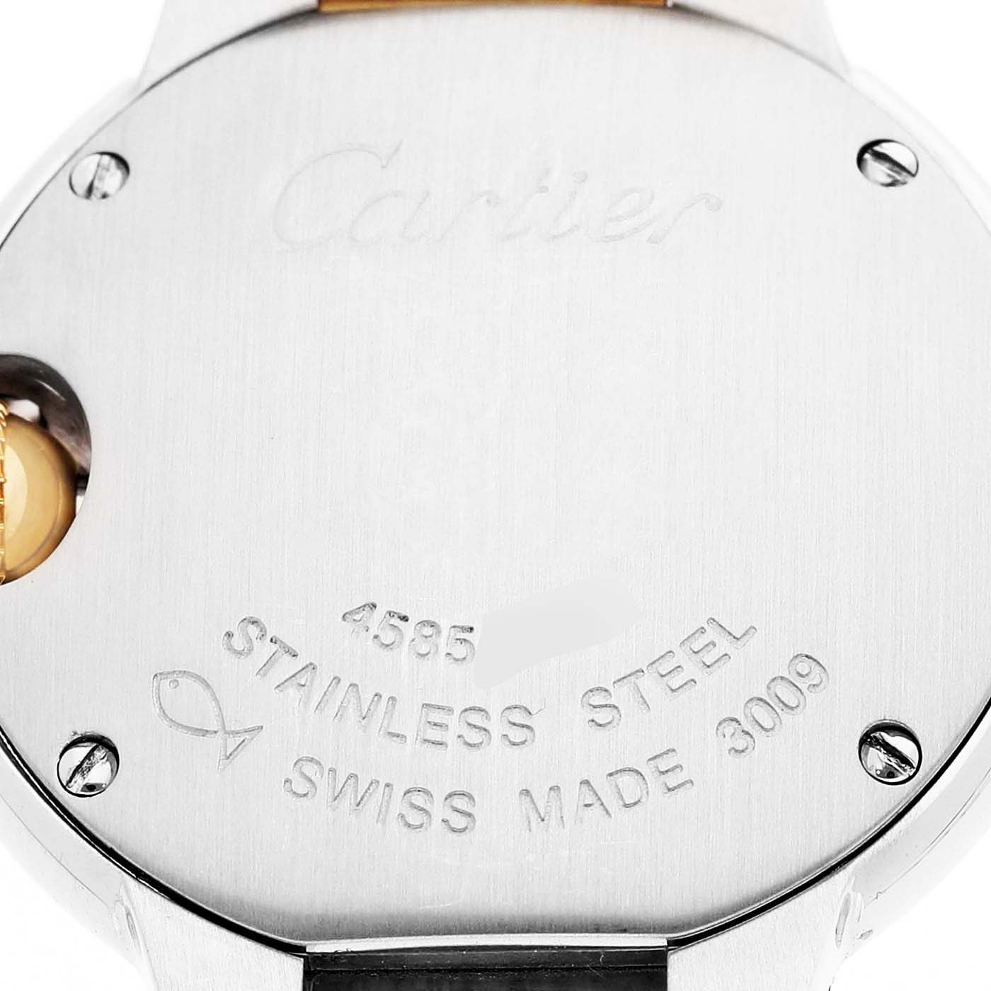 The image shows the case back of a Cartier Ballon Bleu W69007Z3 Women's Stainless Steel Silver Dial watch featuring engraved details and screws.