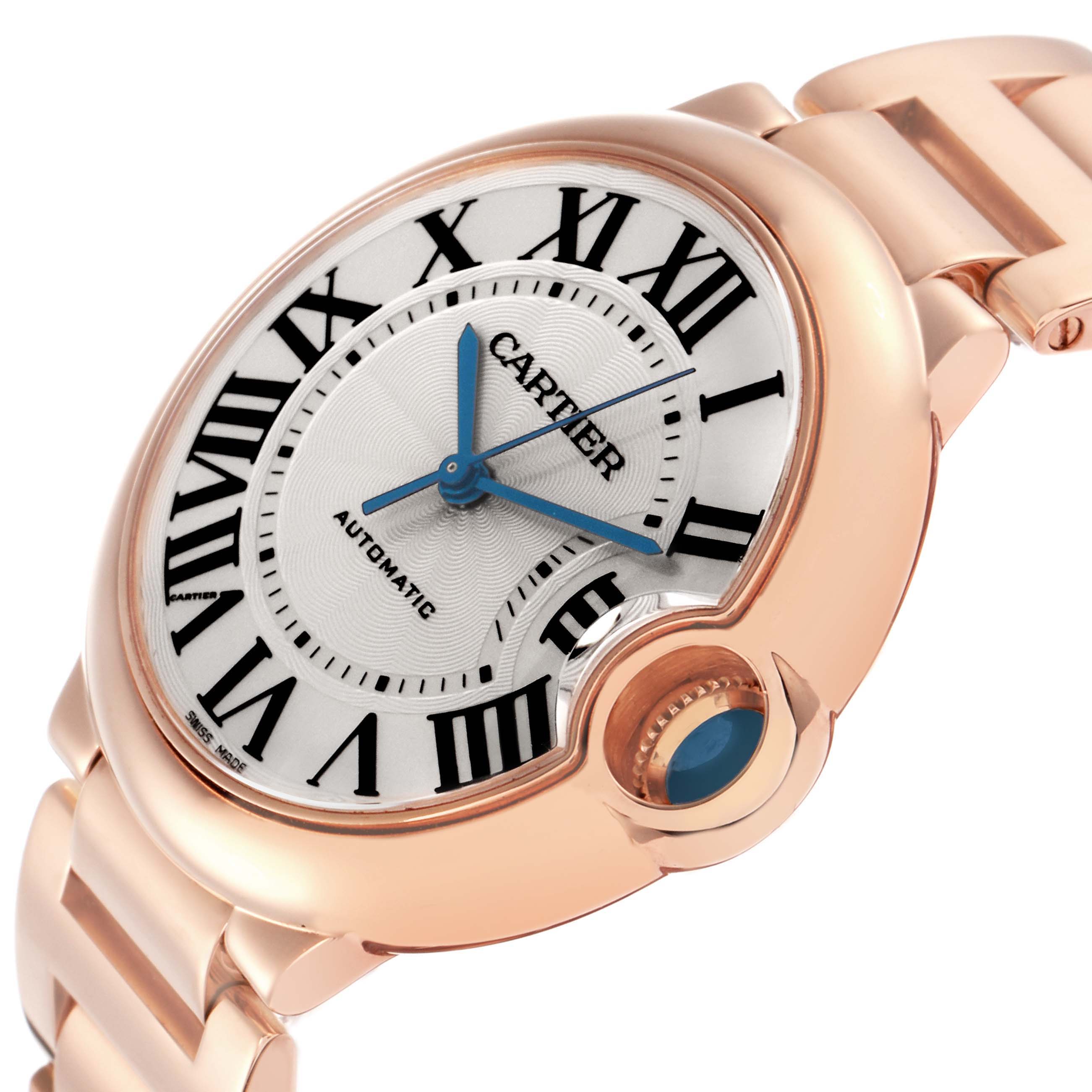 The Cartier Ballon Bleu model W69004Z2 is shown at an angle highlighting its dial, Roman numerals, blue hands, crown with a blue cabochon, and part of the bracelet.