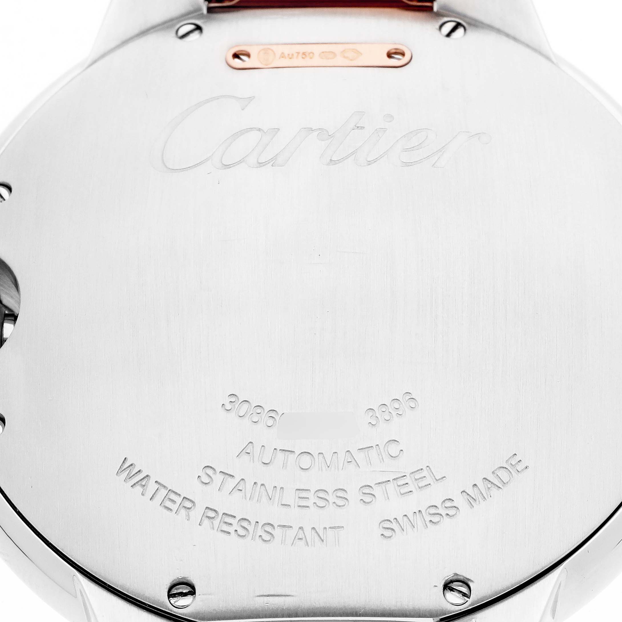 The image shows the back of a Cartier Ballon Bleu model W2BB0004 men's watch, highlighting its stainless steel and water-resistant markings.