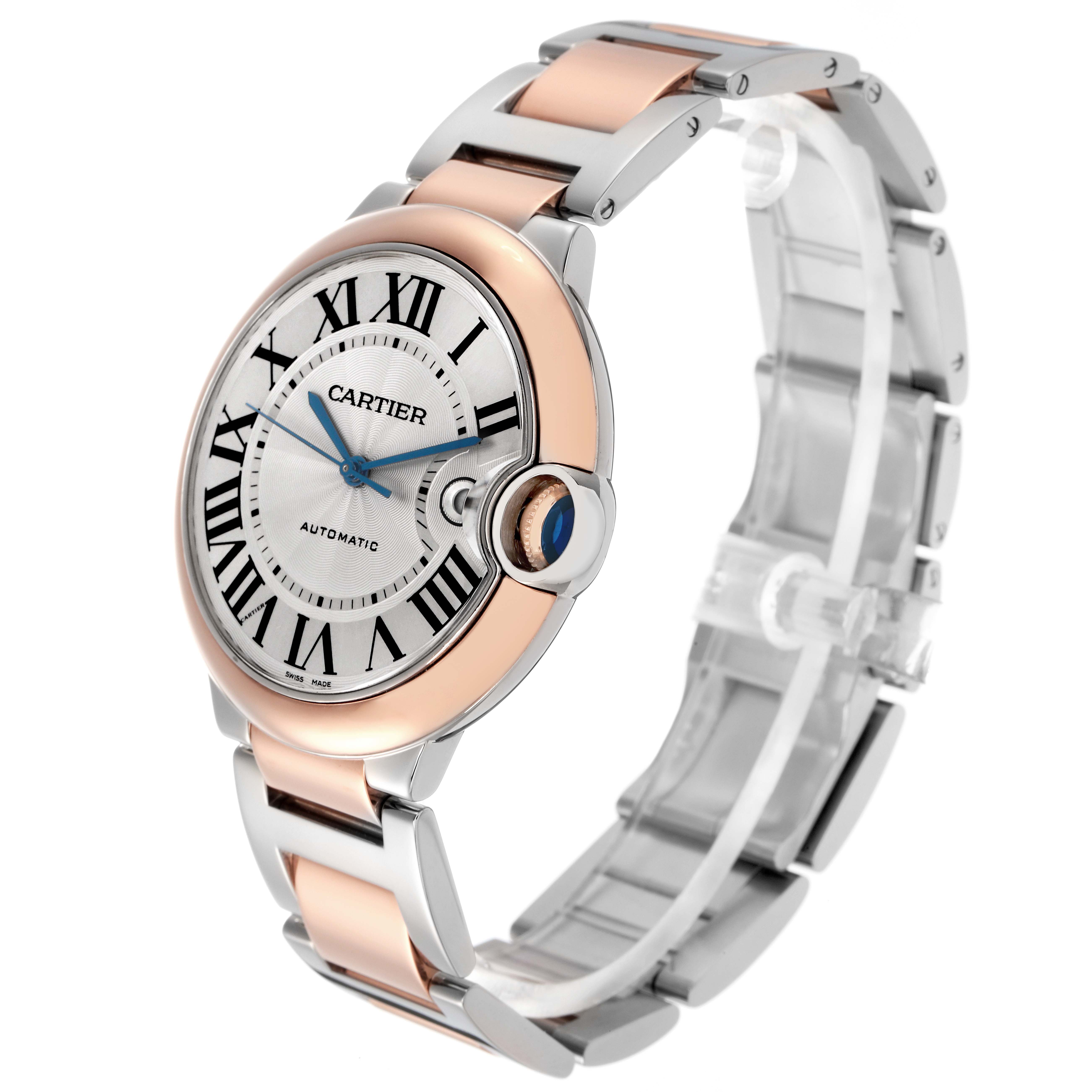 The Cartier Ballon Bleu W2BB0004 watch is shown at a three-quarter angle, highlighting the face, Roman numerals, blue hands, crown, and two-tone bracelet.