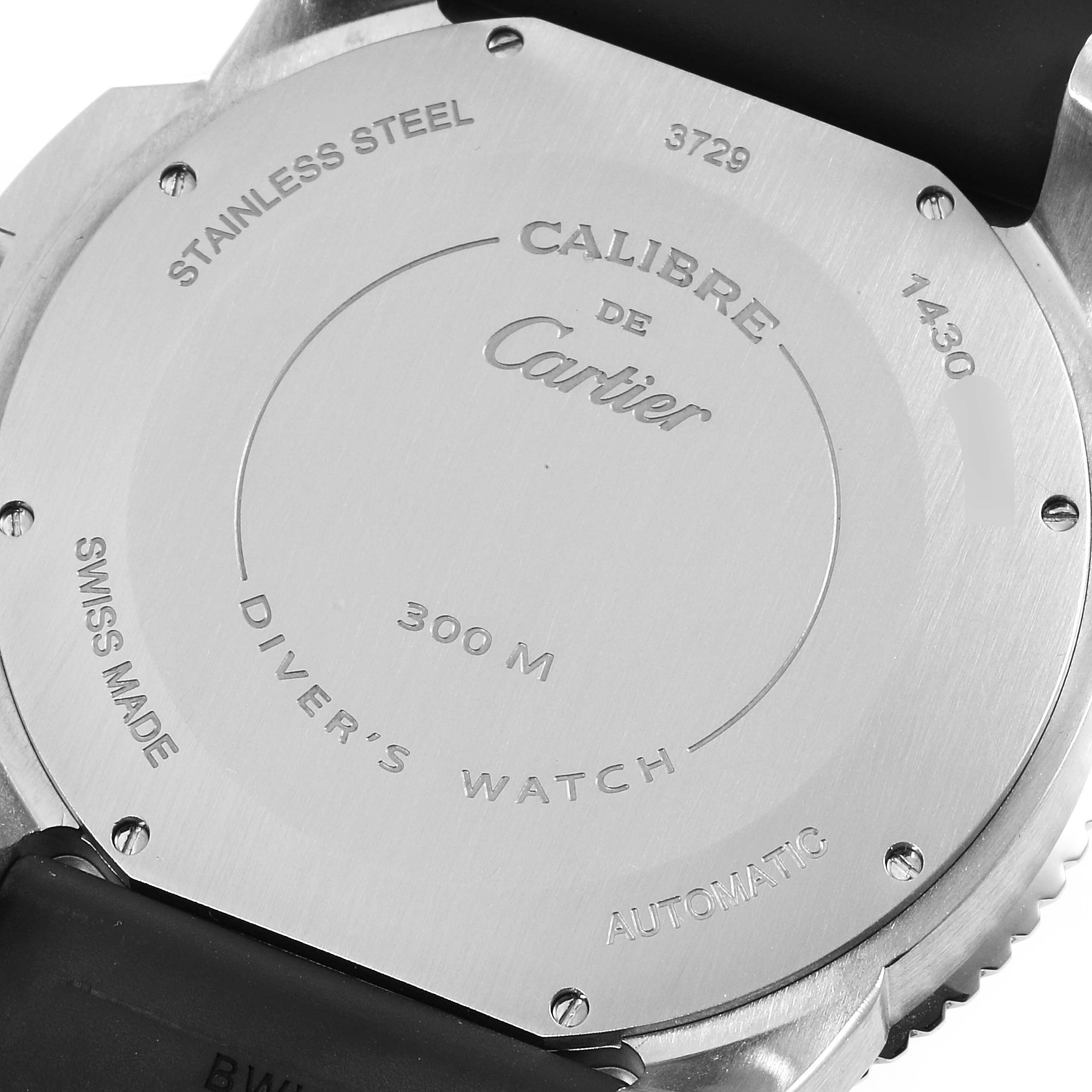 The image shows the back case of a Calibre de Cartier Diver
s Watch by Cartier.