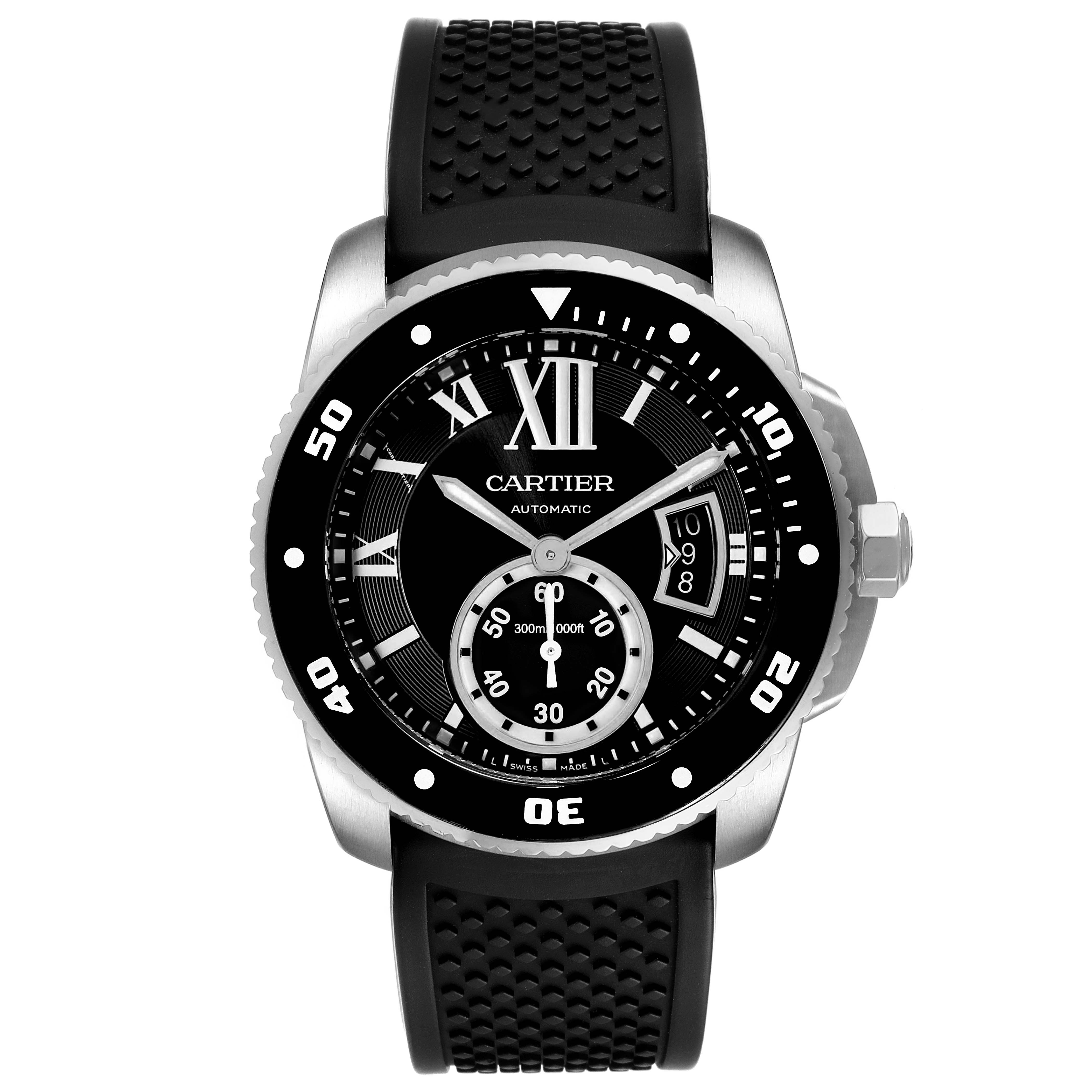 The image shows a full frontal view of a Calibre de Cartier watch by Cartier, displaying its black dial, stainless steel case, and rubber strap.