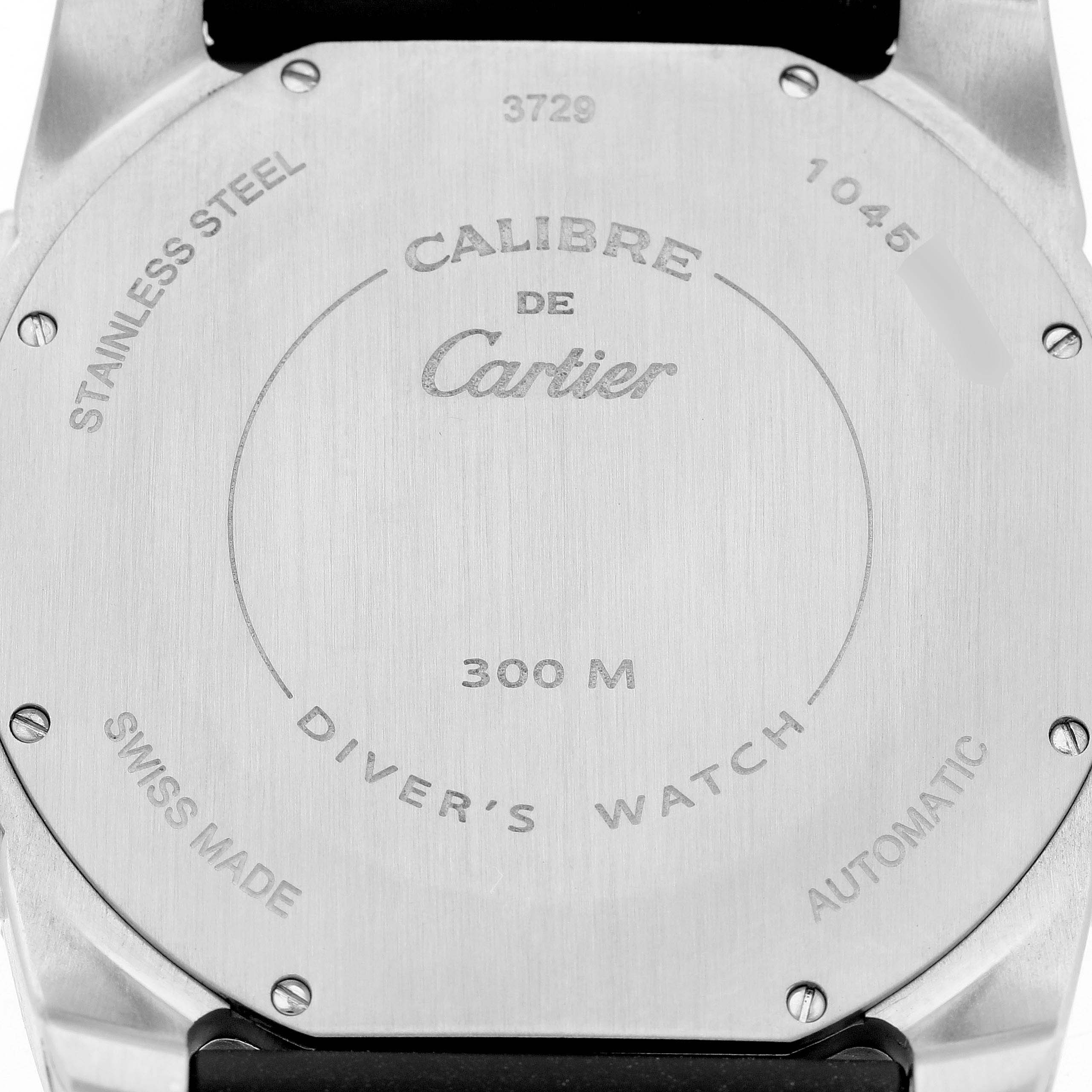 The image shows the back of a Calibre de Cartier watch by Cartier, displaying its details and markings.