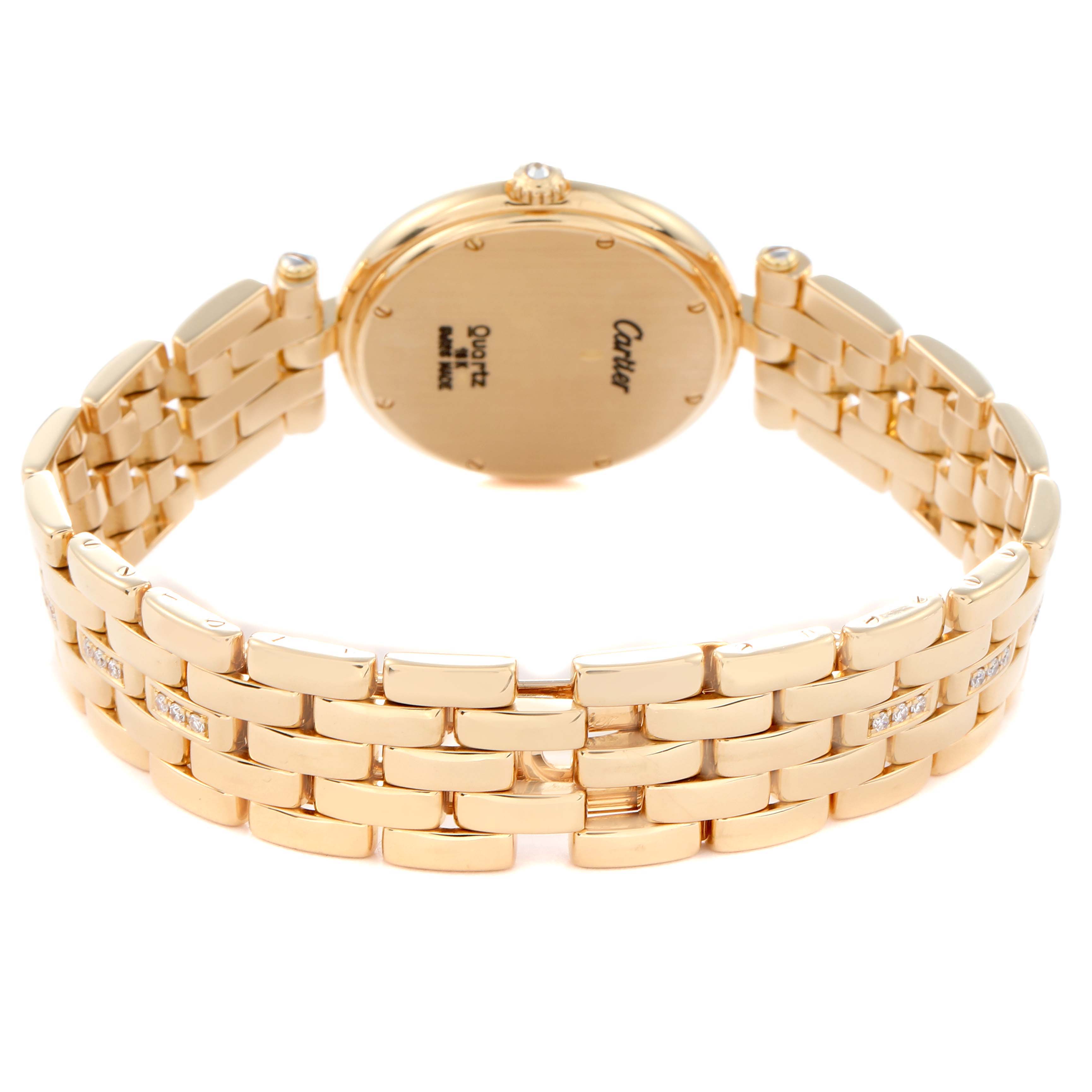 The image shows the Panthere model by Cartier, model number 884701FD, from a rear angle displaying the back case and gold bracelet with links and gemstones.