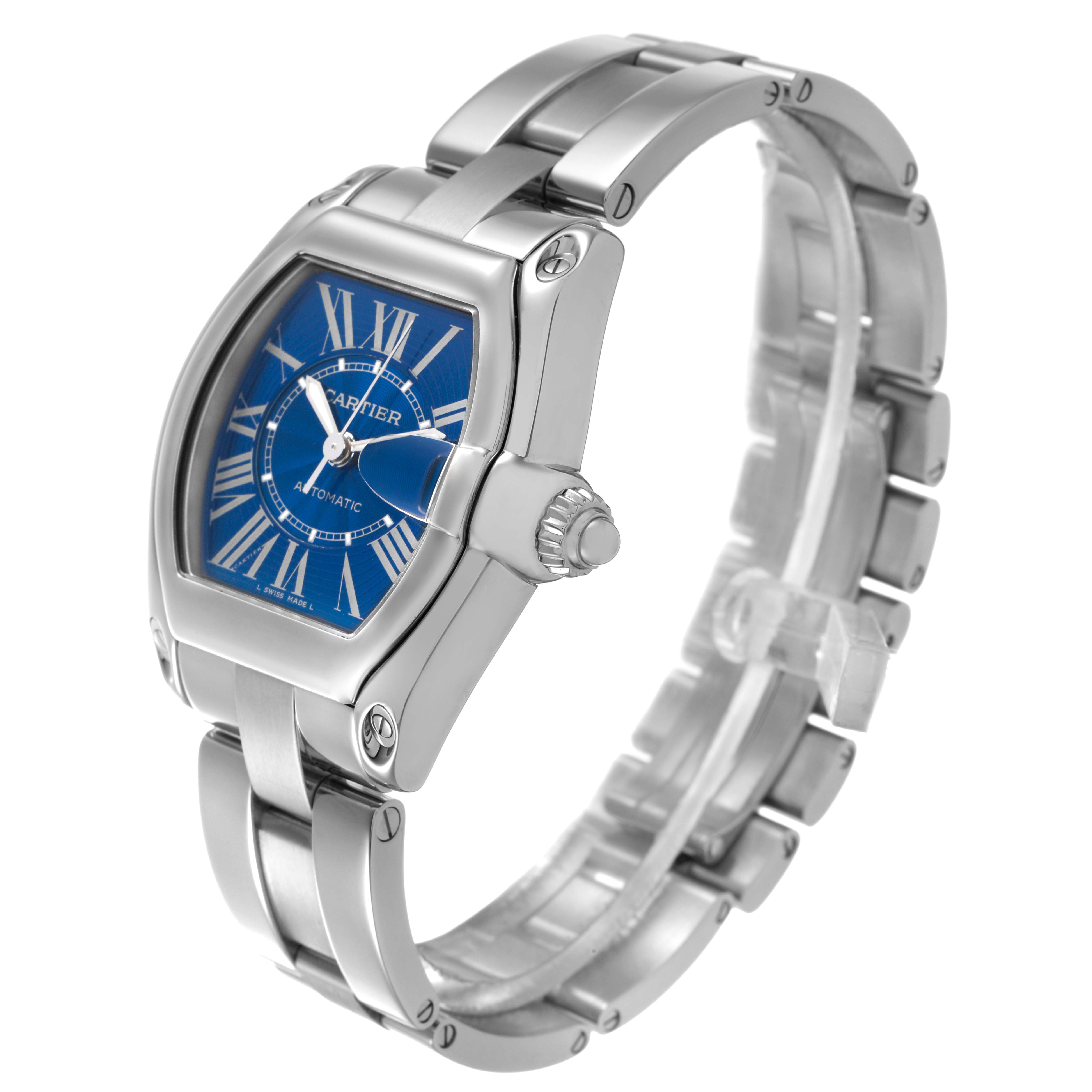 The Cartier Roadster W62048V3 Men's Stainless Steel Blue Dial watch is shown from a front angle, highlighting the blue dial, crown, stainless steel bracelet, and case details.