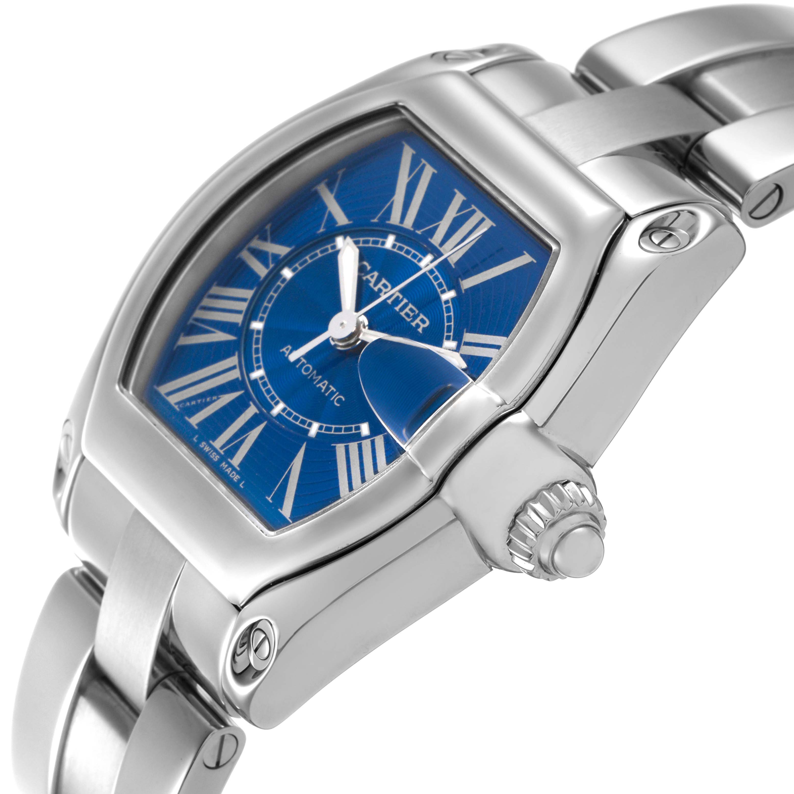 The Cartier Roadster W62048V3 Men's Stainless Steel Blue Dial watch is shown at a side angle, highlighting the blue dial, crown, and bracelet.