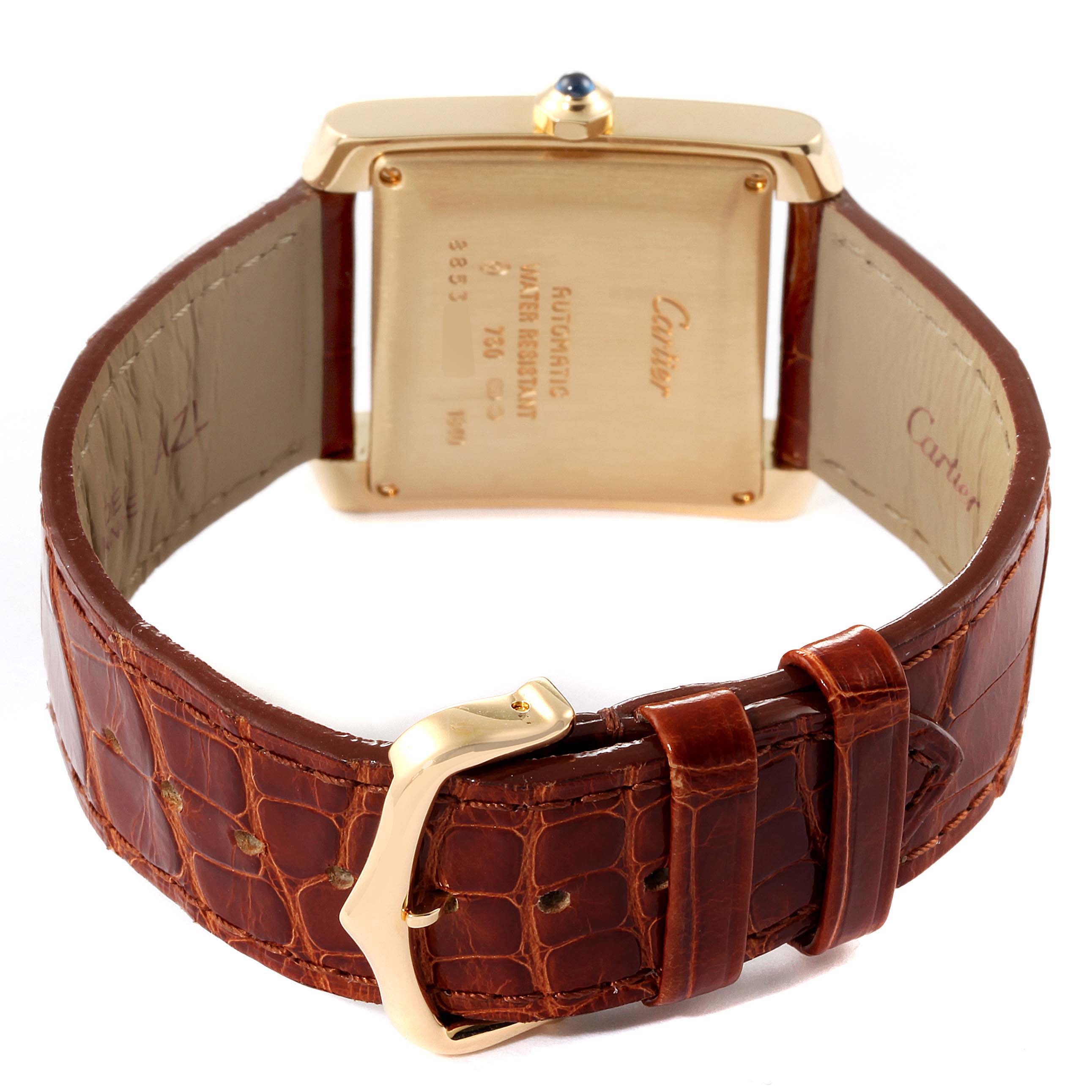 The image shows the back view of a Cartier Tank Francaise W5000156 Men's Yellow Gold Silver Dial W5000156 Men's Yellow Gold Silver Dial watch, displaying its case back, leather strap, and buckle.