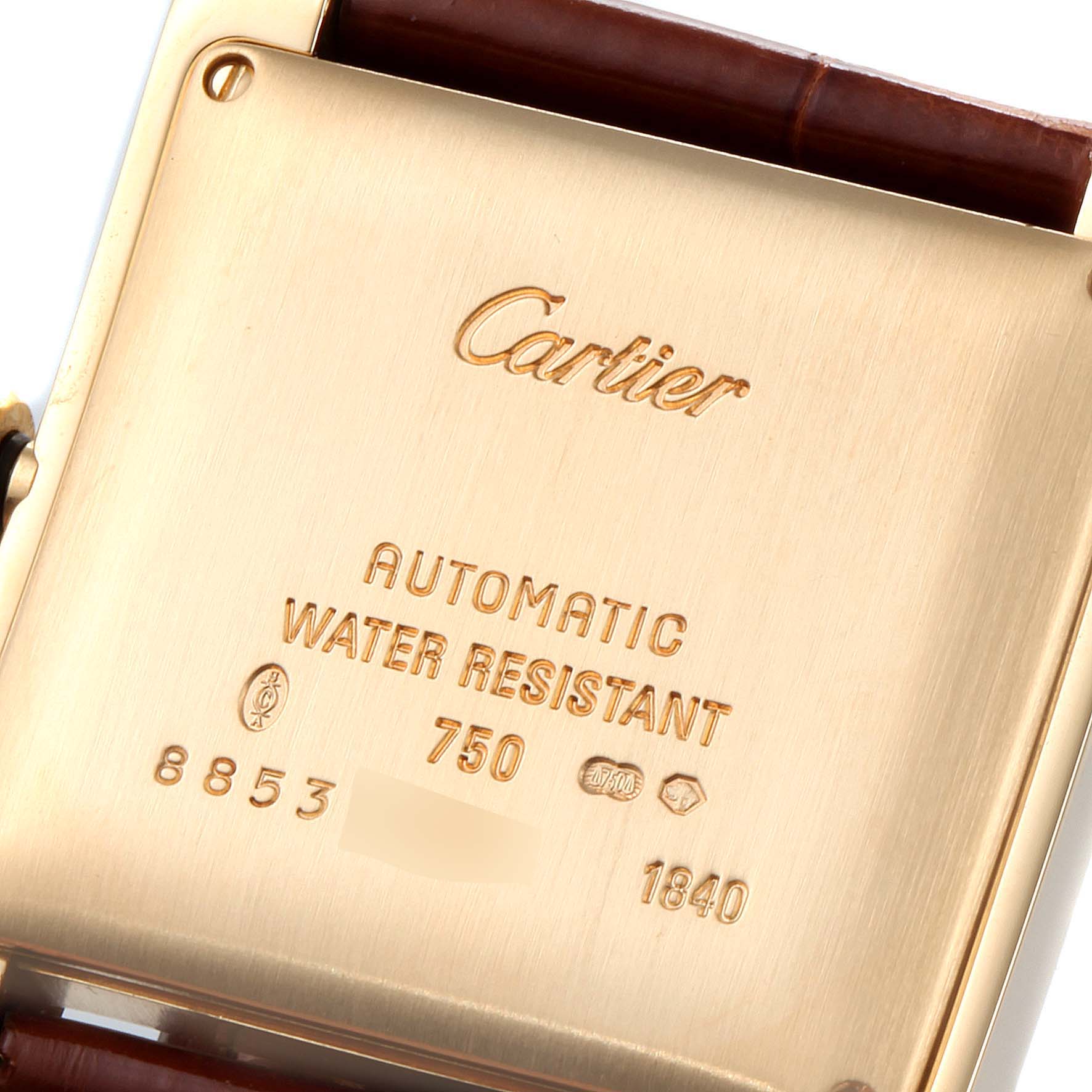 This image shows the back case of a Cartier Tank Française watch, highlighting the engravings and leather strap.