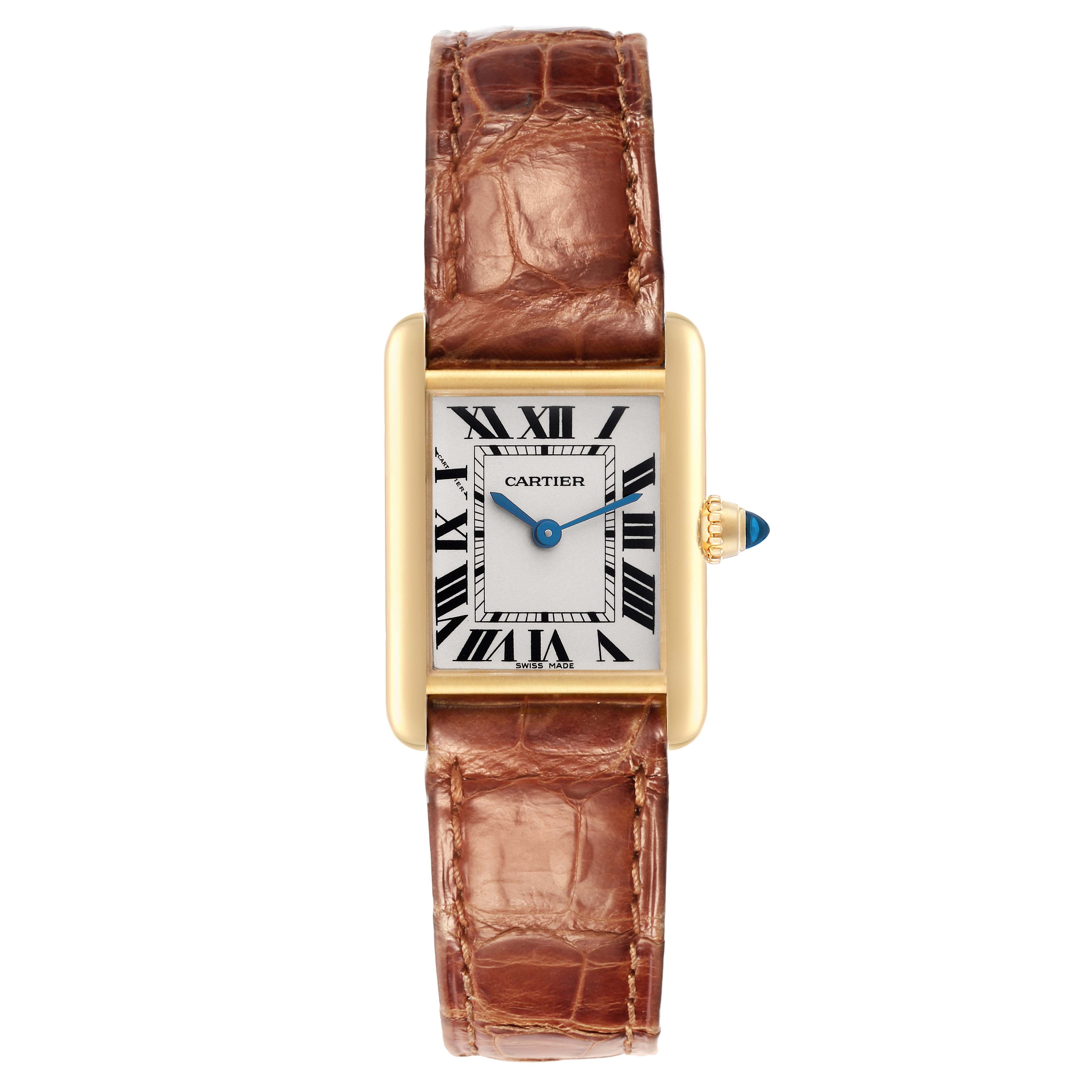The Cartier Tank Louis model, W1529856, is shown from the front, highlighting the rectangular gold case, white dial with Roman numerals, and a brown leather strap.