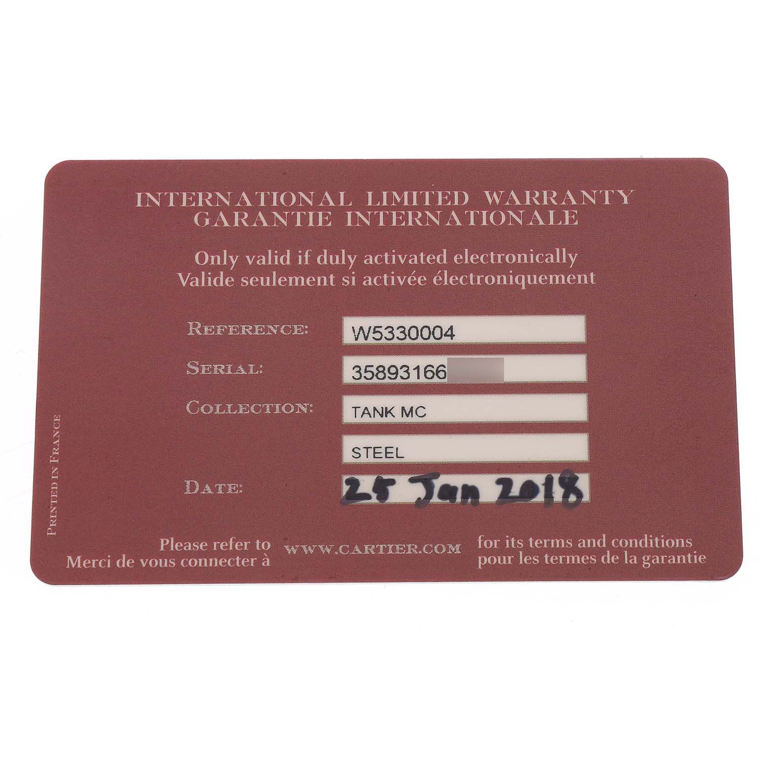 The image shows an International Limited Warranty card for a Cartier Tank MC W5330004 Men's Stainless Steel Black Dial watch.
