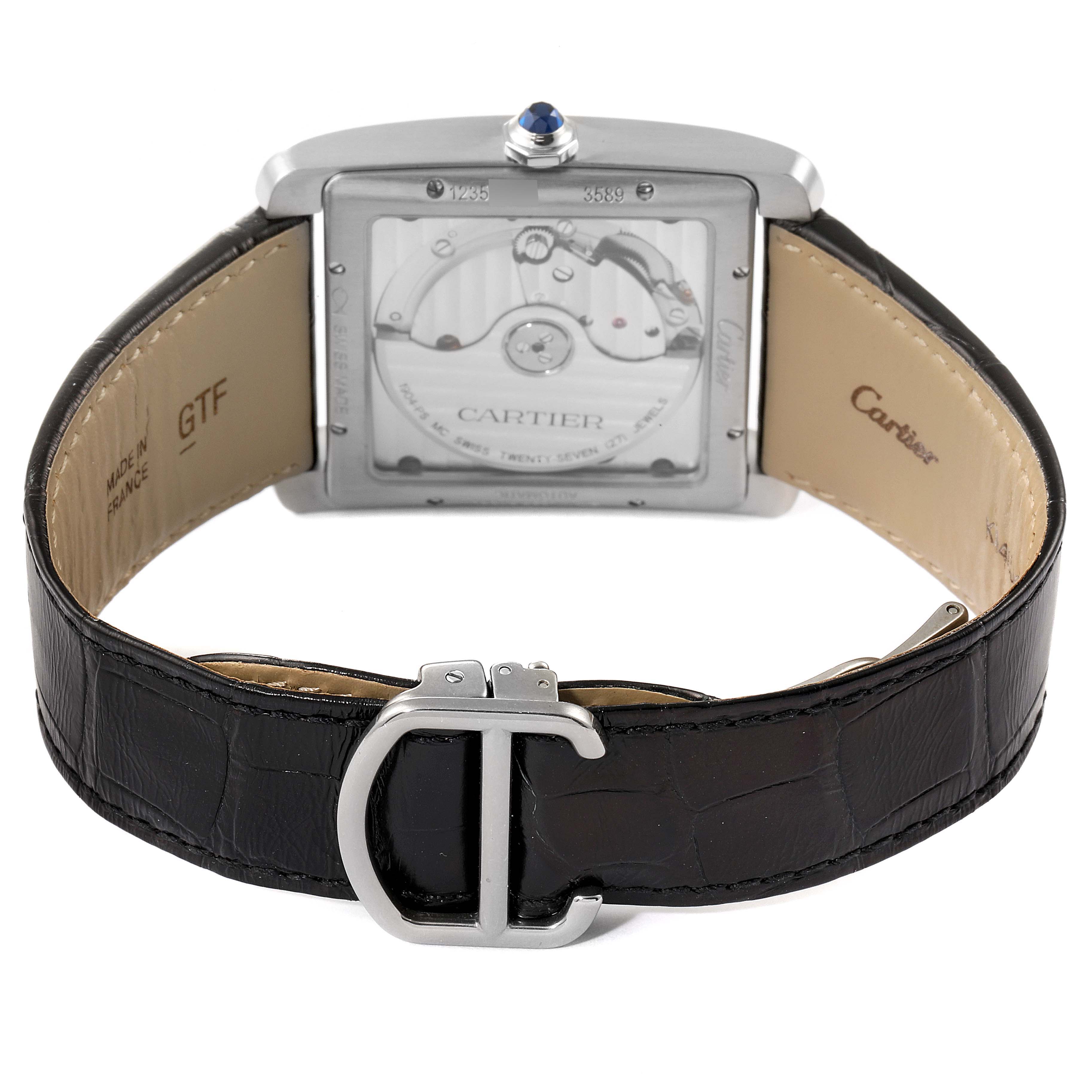 The image shows the back view of the Cartier Tank MC W5330003 Men
s Stainless Steel Silver Dial W5330003 Men
s Stainless Steel Silver Dial watch, focusing on the movement and leather strap.